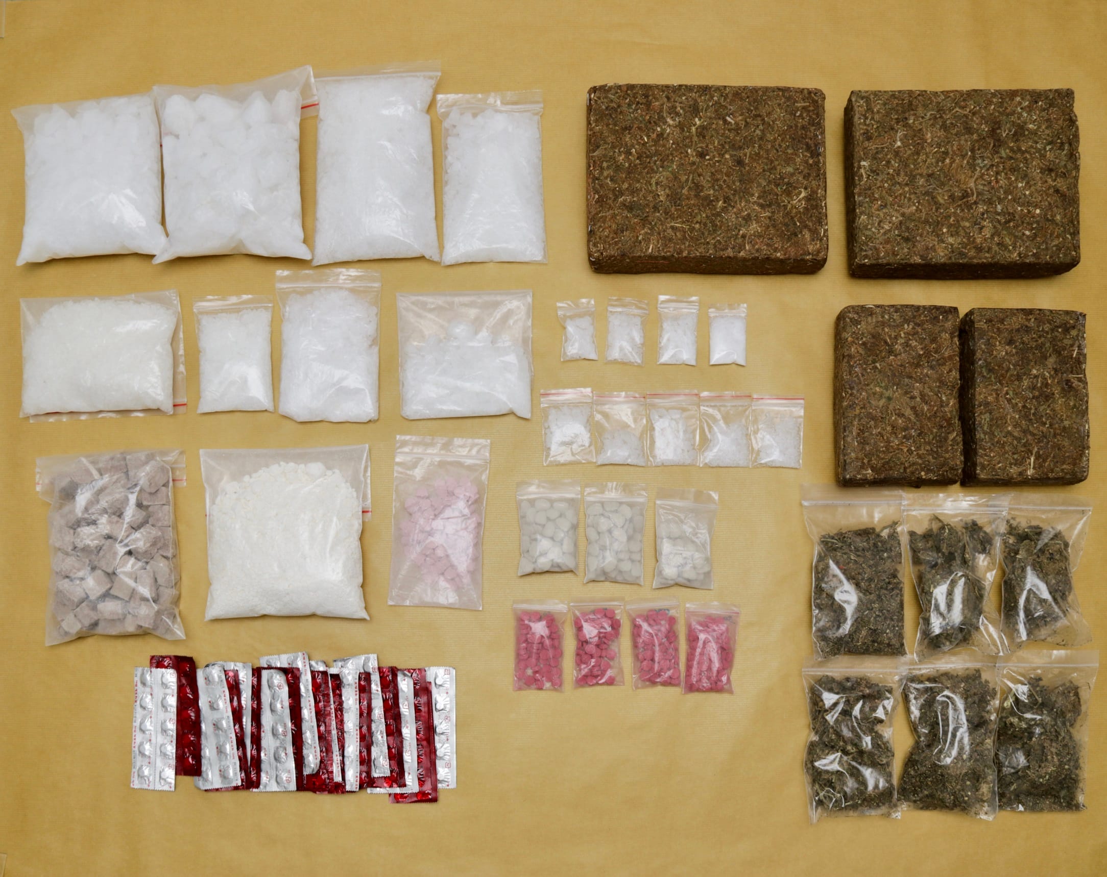 Assorted drugs: white crystals, pills in blister packs and bags of plant matter.