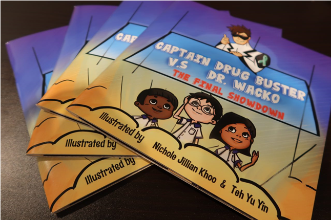 Stack of "Captain Drug Buster" books. Cartoon characters on the cover.