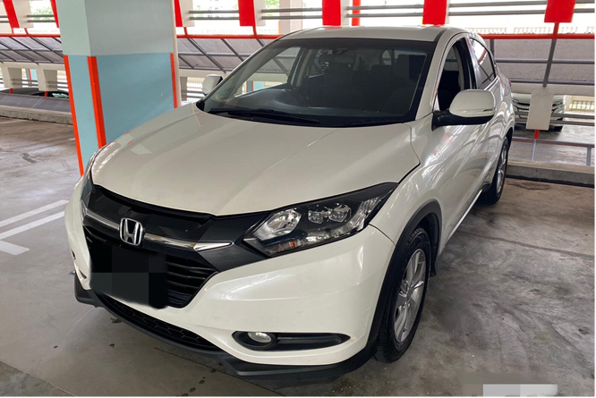 White Honda HR-V parked in a garage, facing the viewer.