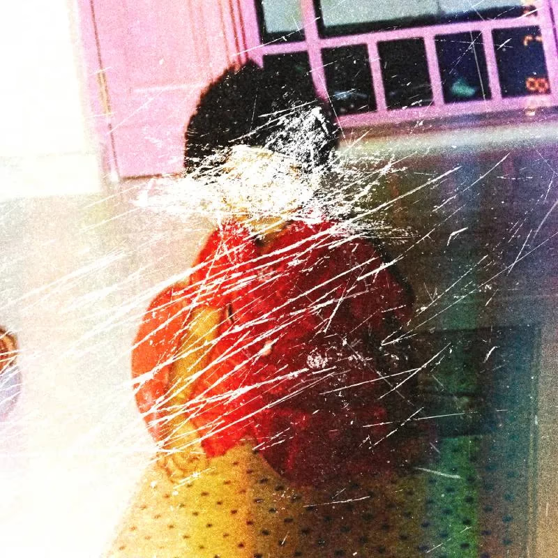 Scratched out photo of a child