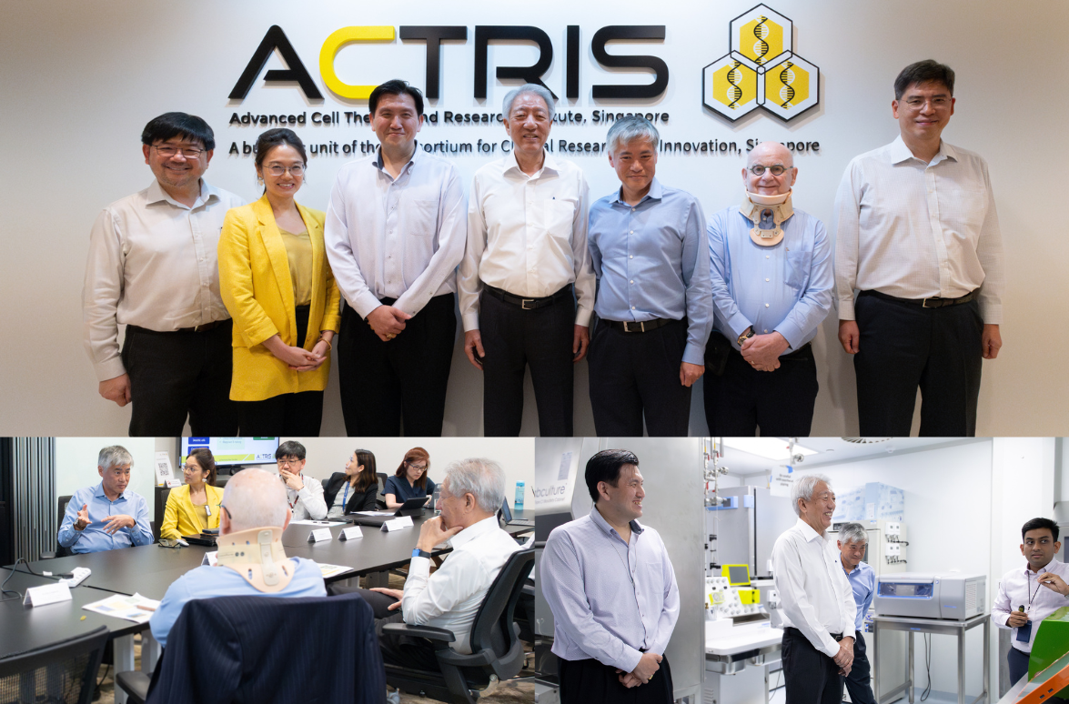 People standing and sitting in a meeting and laboratory environment with "ACTRIS" signage visible in the background.