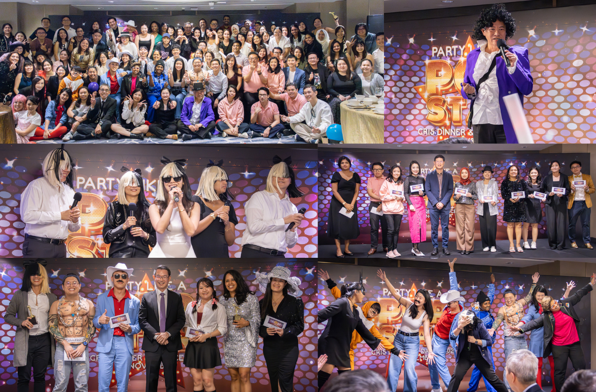A large group of people posed for a photo, with smaller groups and individuals dressed up and holding awards on a stage.