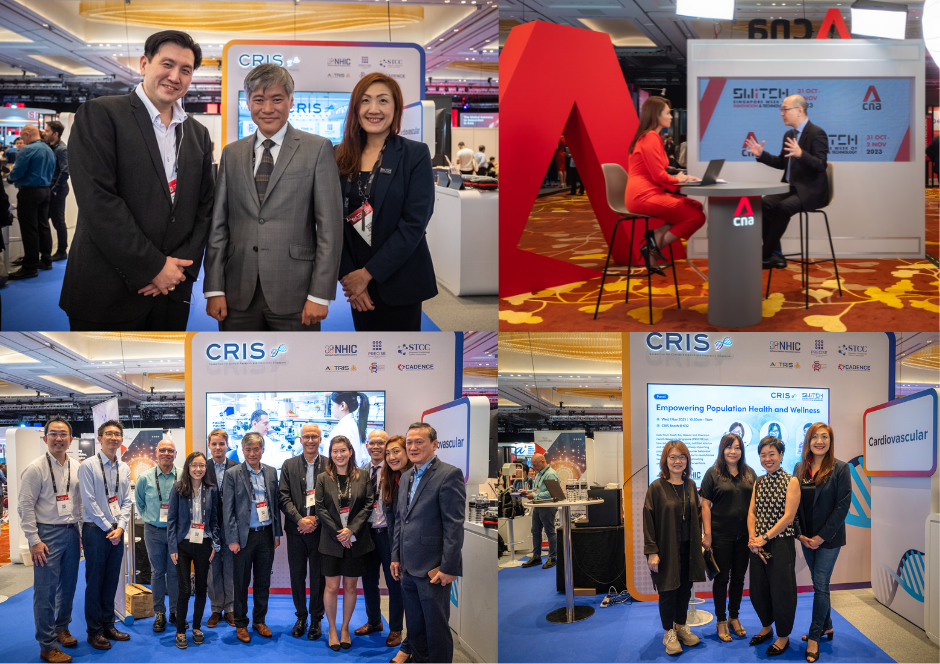 People in business attire standing in front of display booths and sitting at a table at an indoor event.