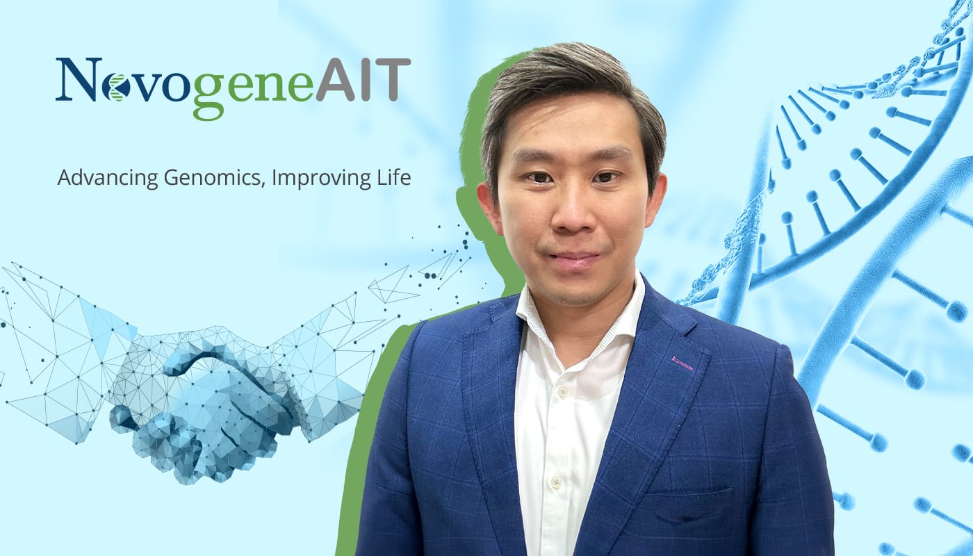 A man in a blue suit stands in front of text "NovogeneAI," a DNA strand, and a 3D model of a handshake.
