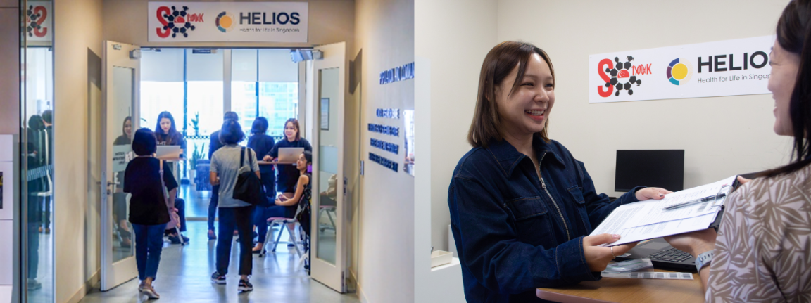Two women are talking at a counter beside a sign reading "HELIOS"; several people are walking through double doors on the left.