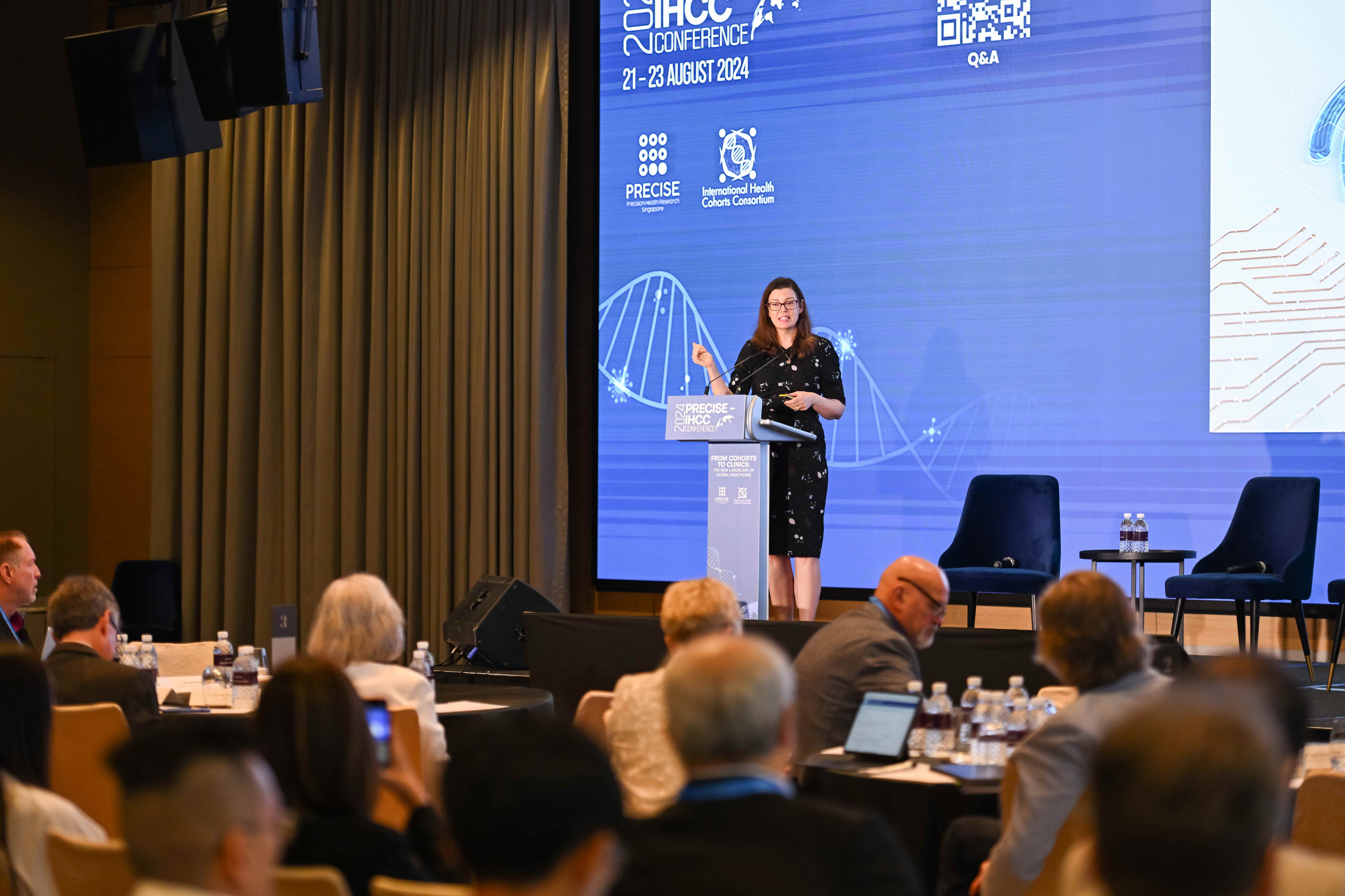 Angela speaking at the PRECISE IHCC Conference