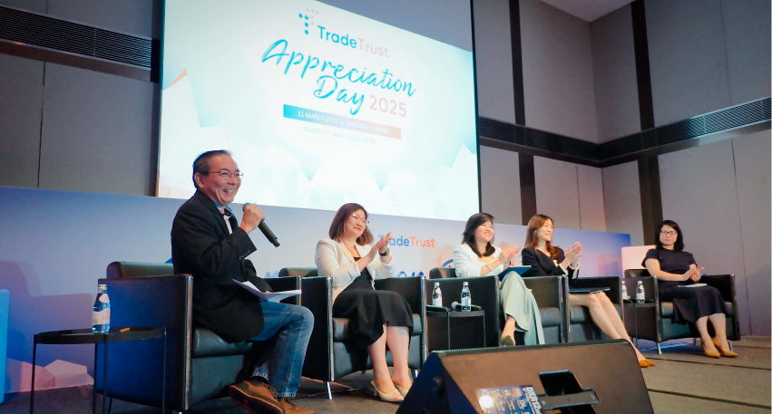 Five people seated and talking on stage with "Appreciation Day 2025" displayed on the screen behind them.