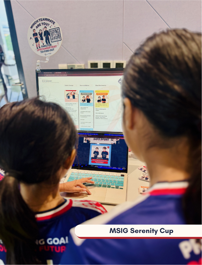 Two children in sports jerseys play the Upstander Test on a computer screen under a sign asking, "Which teammate are you?"