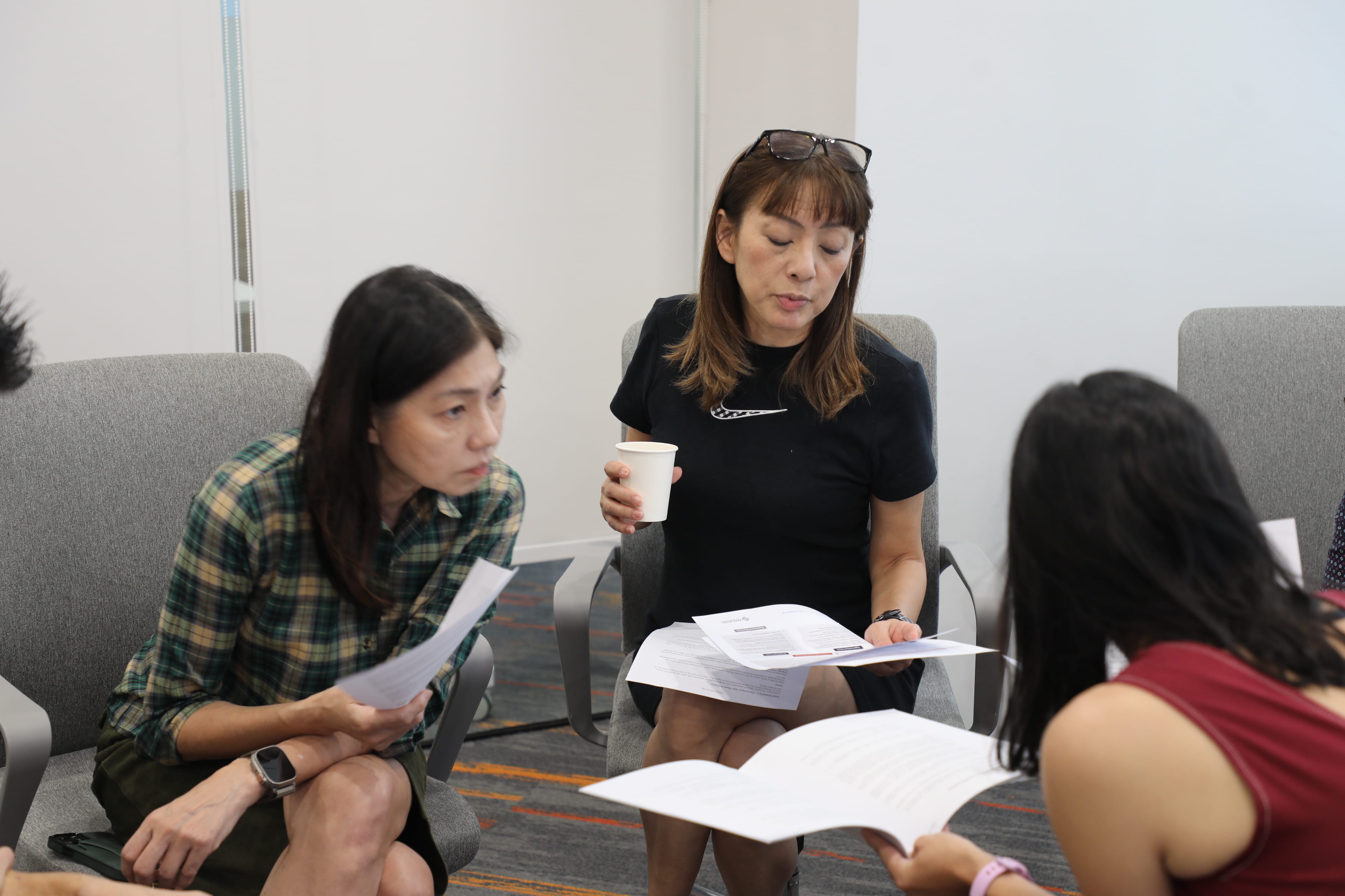 Three women sitting together in a room, discussing various topics.