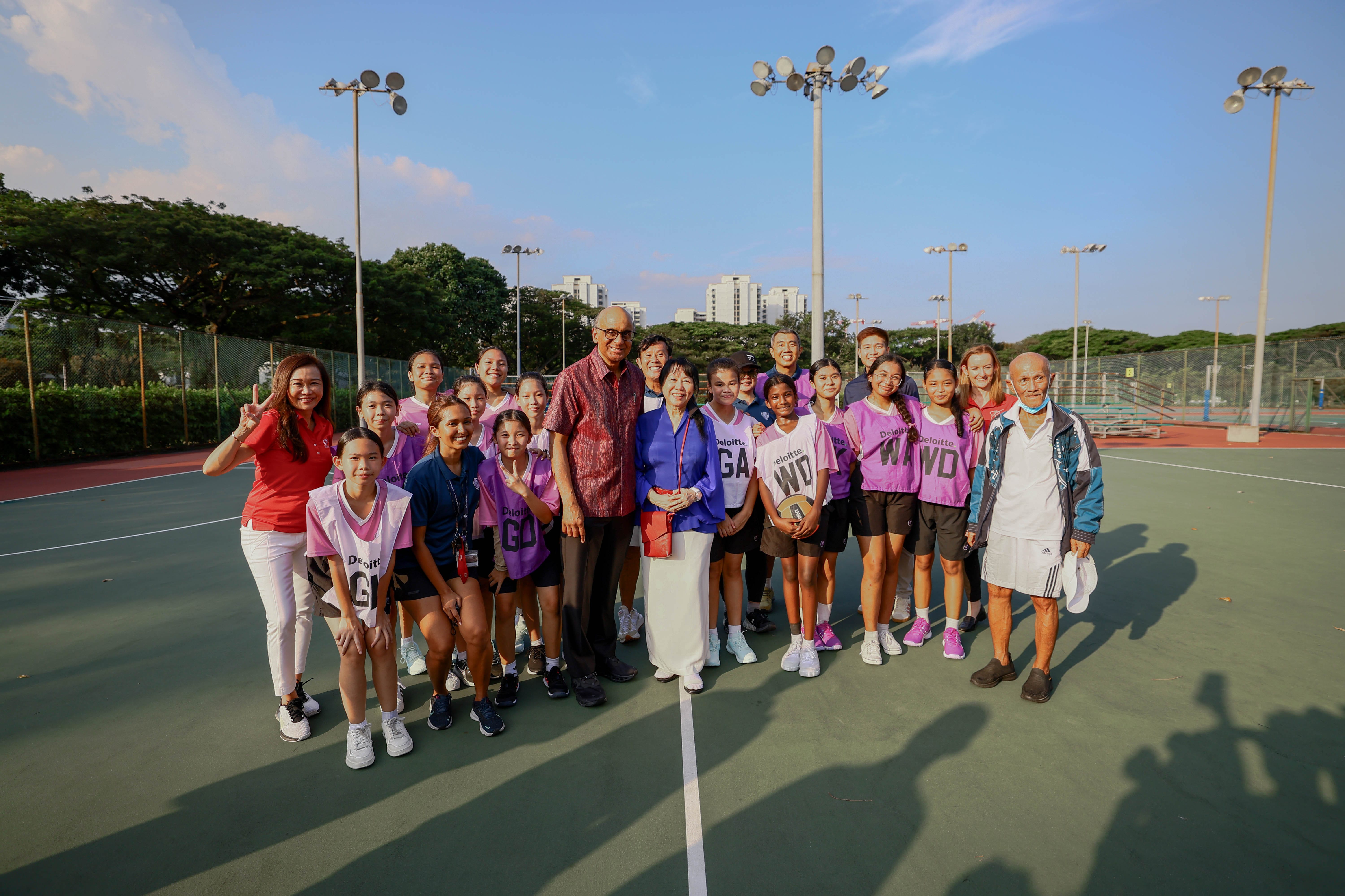 President Tharman in a group photo with a group of students