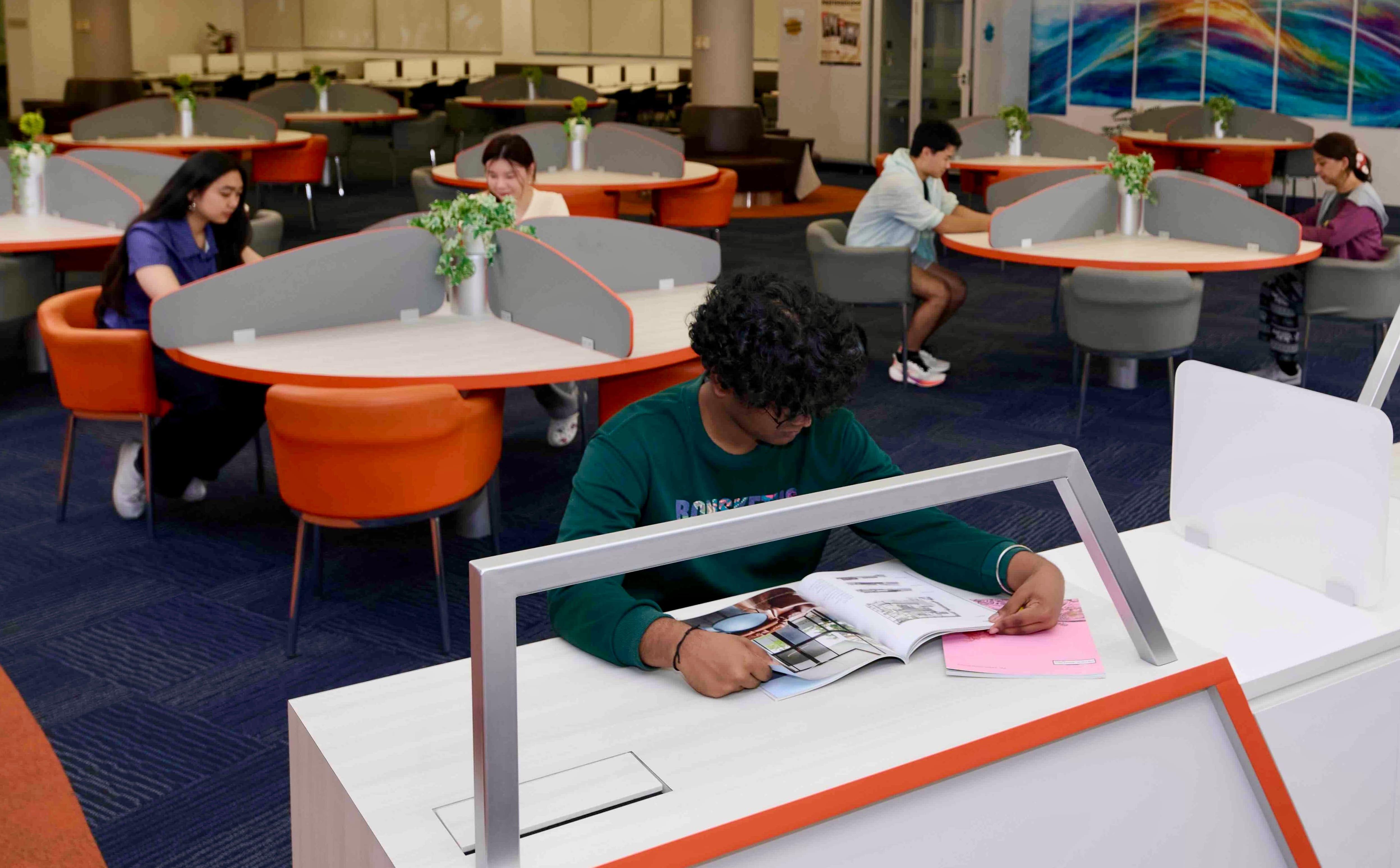 Student working quietly in the library