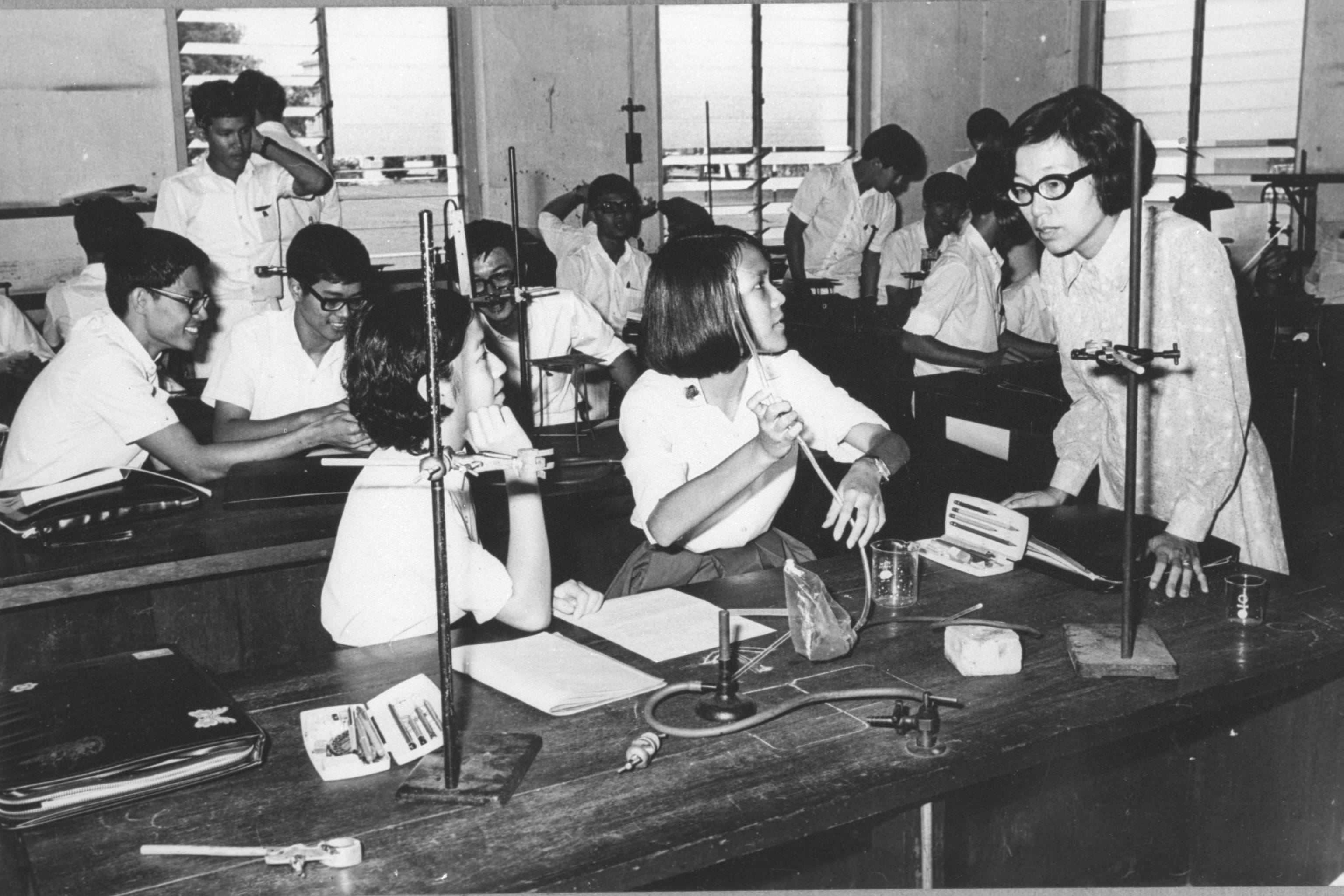 Students and teacher in a science lab at the Bras Basah Campus