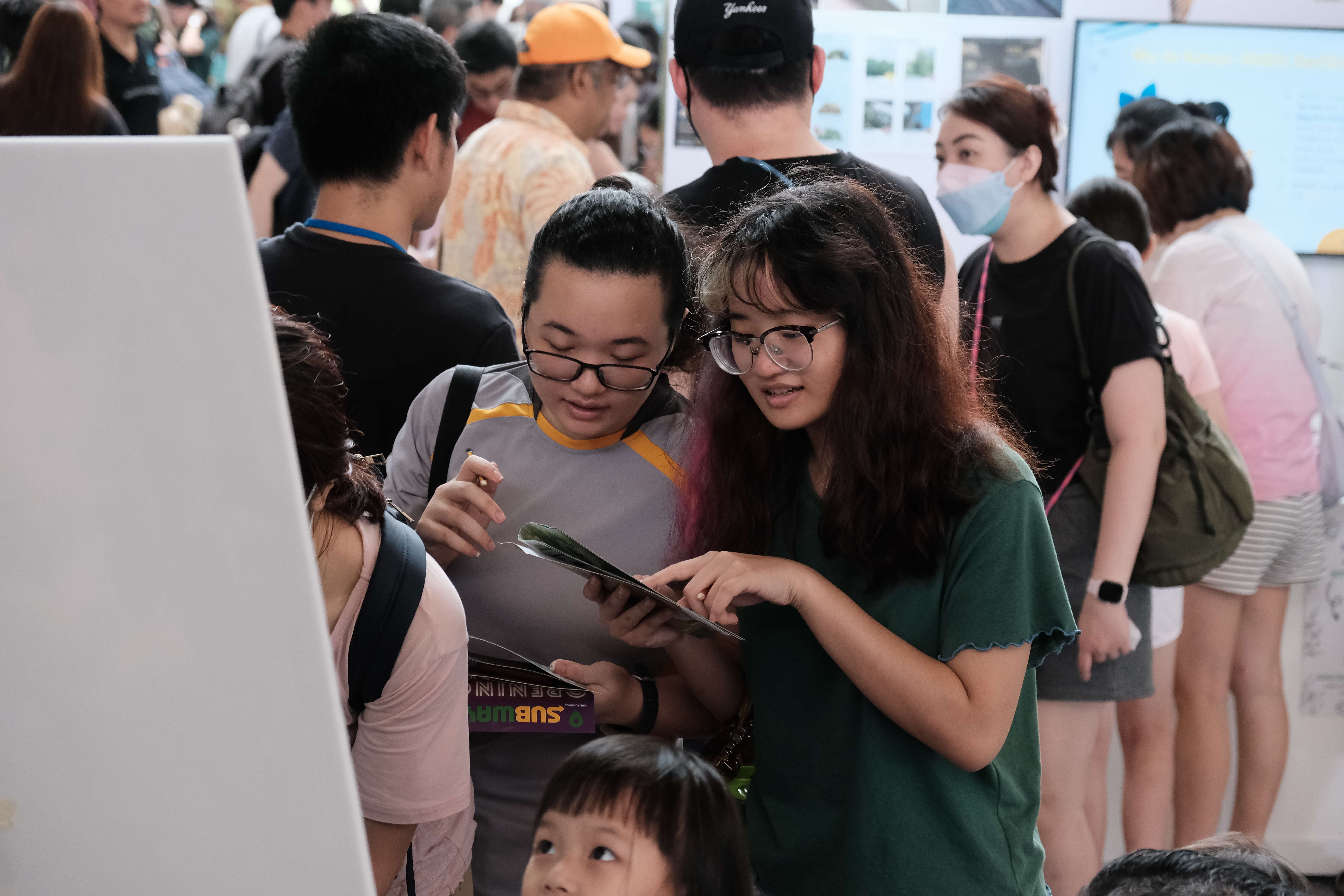 Visitors participating in a game station at the Festival