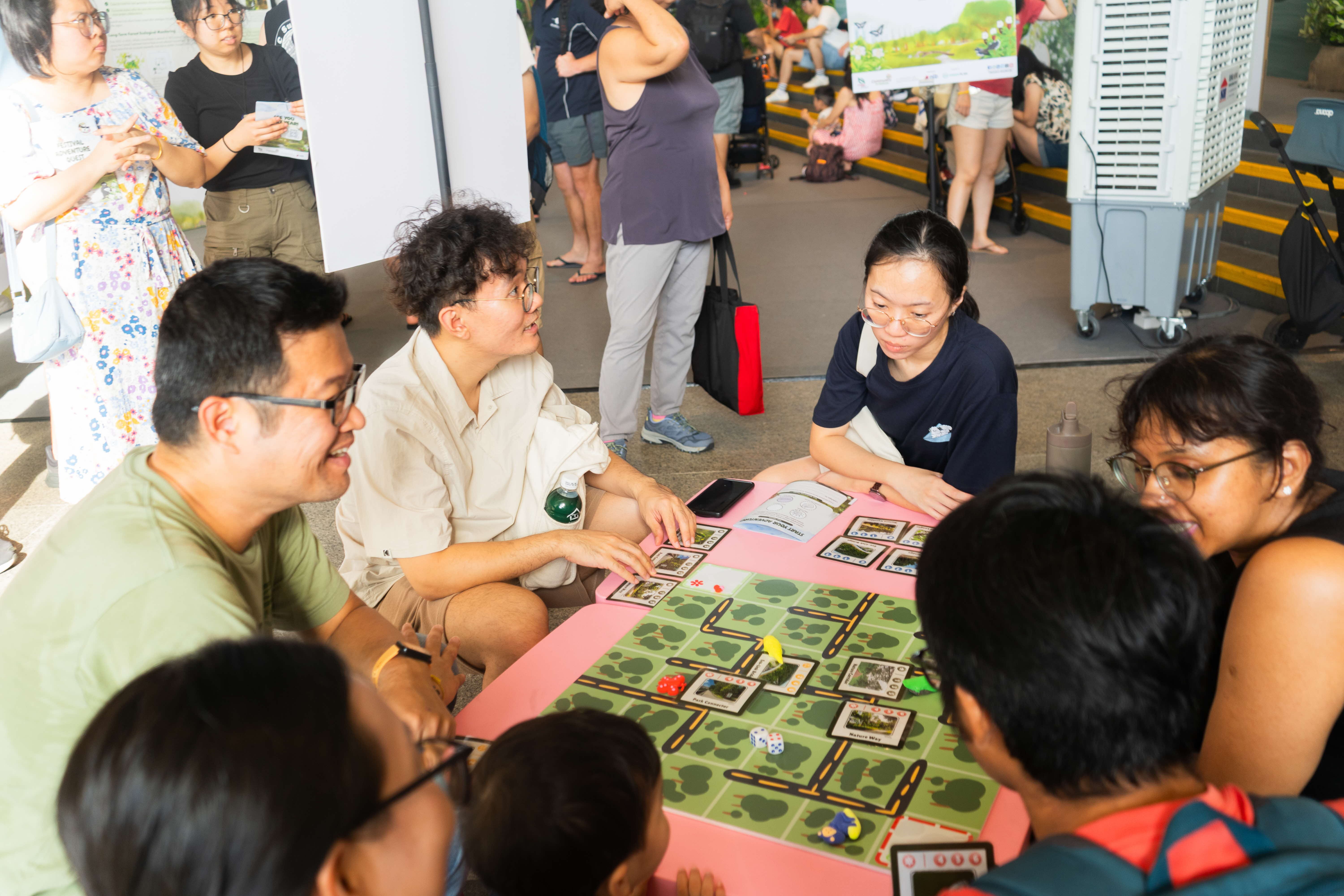 Visitors participating in a game station "Food Hoppers" at the Festival.