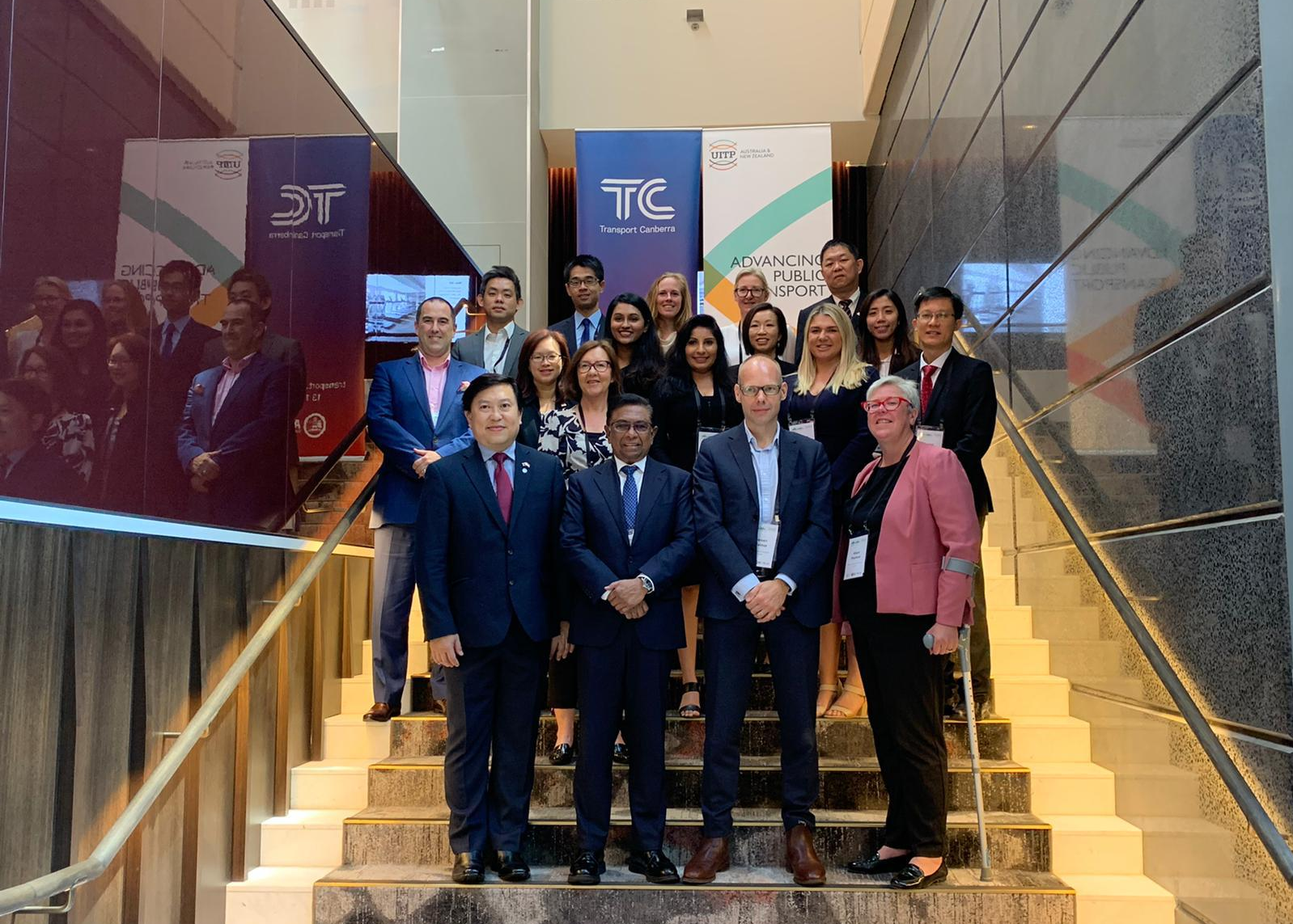 Delegates from PTC and UITP gathered for a group photo at a transport conference.