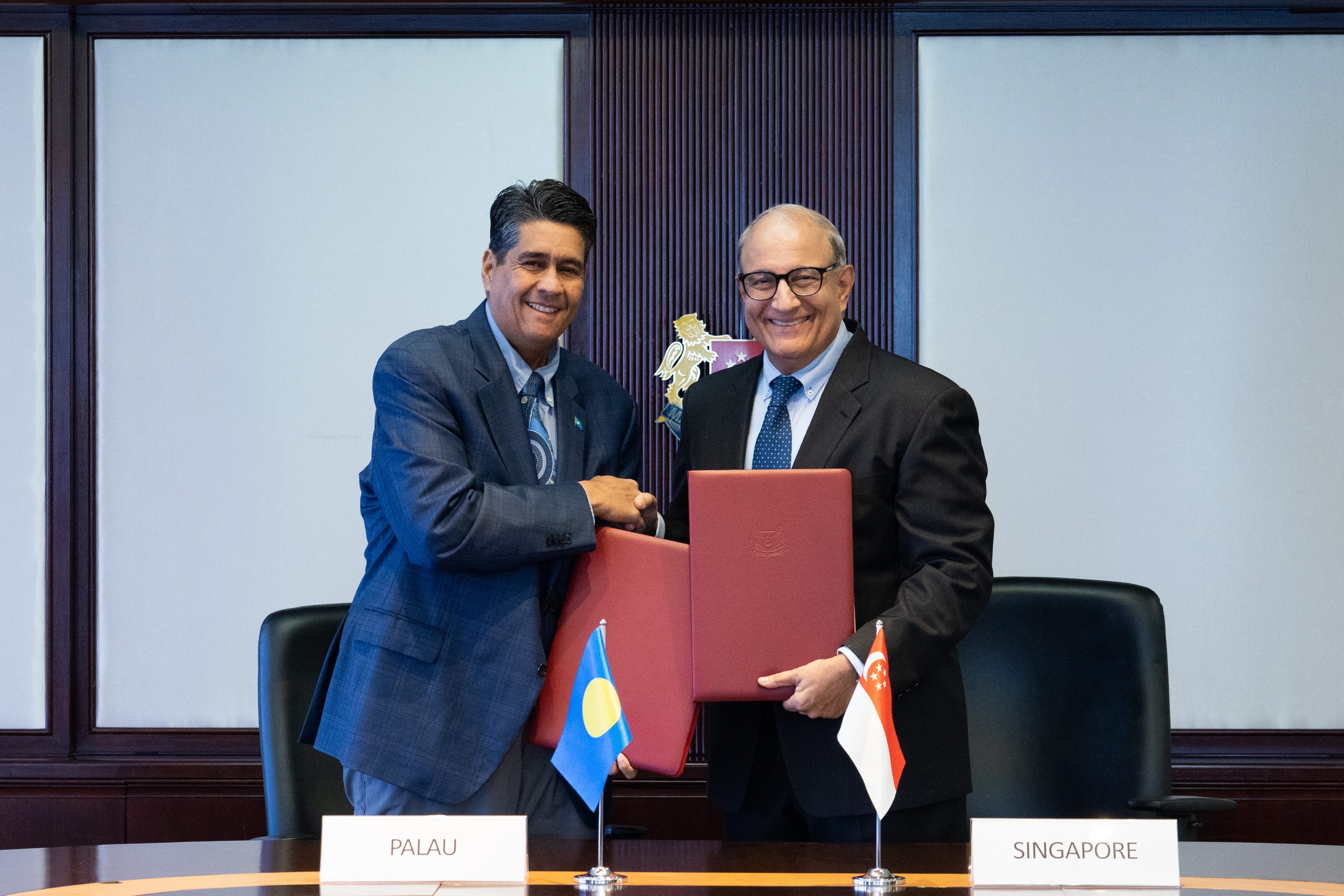 Palau President Mr Surangel Whipps Jr (left) and Minister for Transport and Minister-in-charge of Trade Relations, Mr S Iswaran (right), at the signing of the ASA and CMU