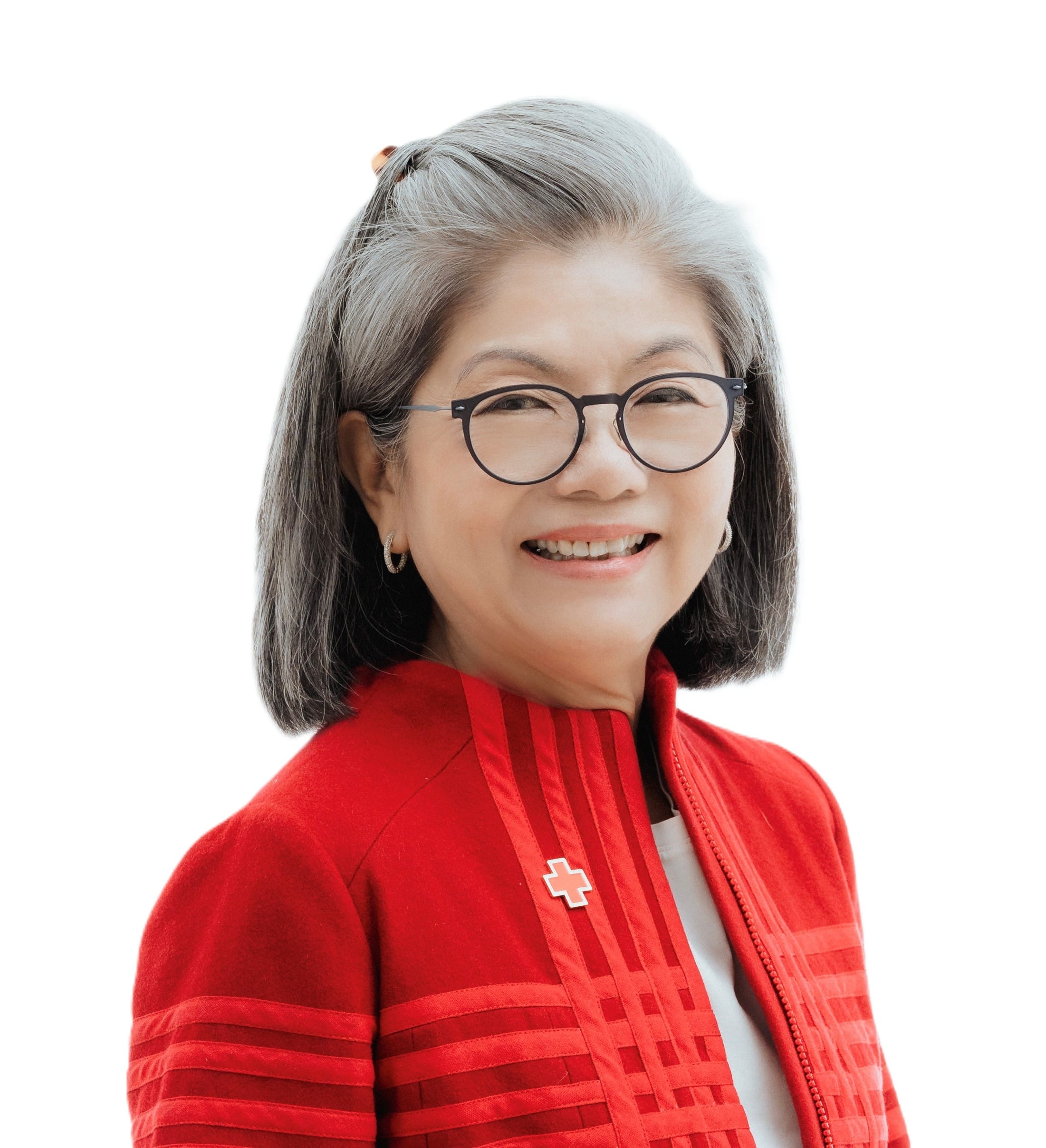 Portrait of woman with short hair, wearing a red top, smiling.