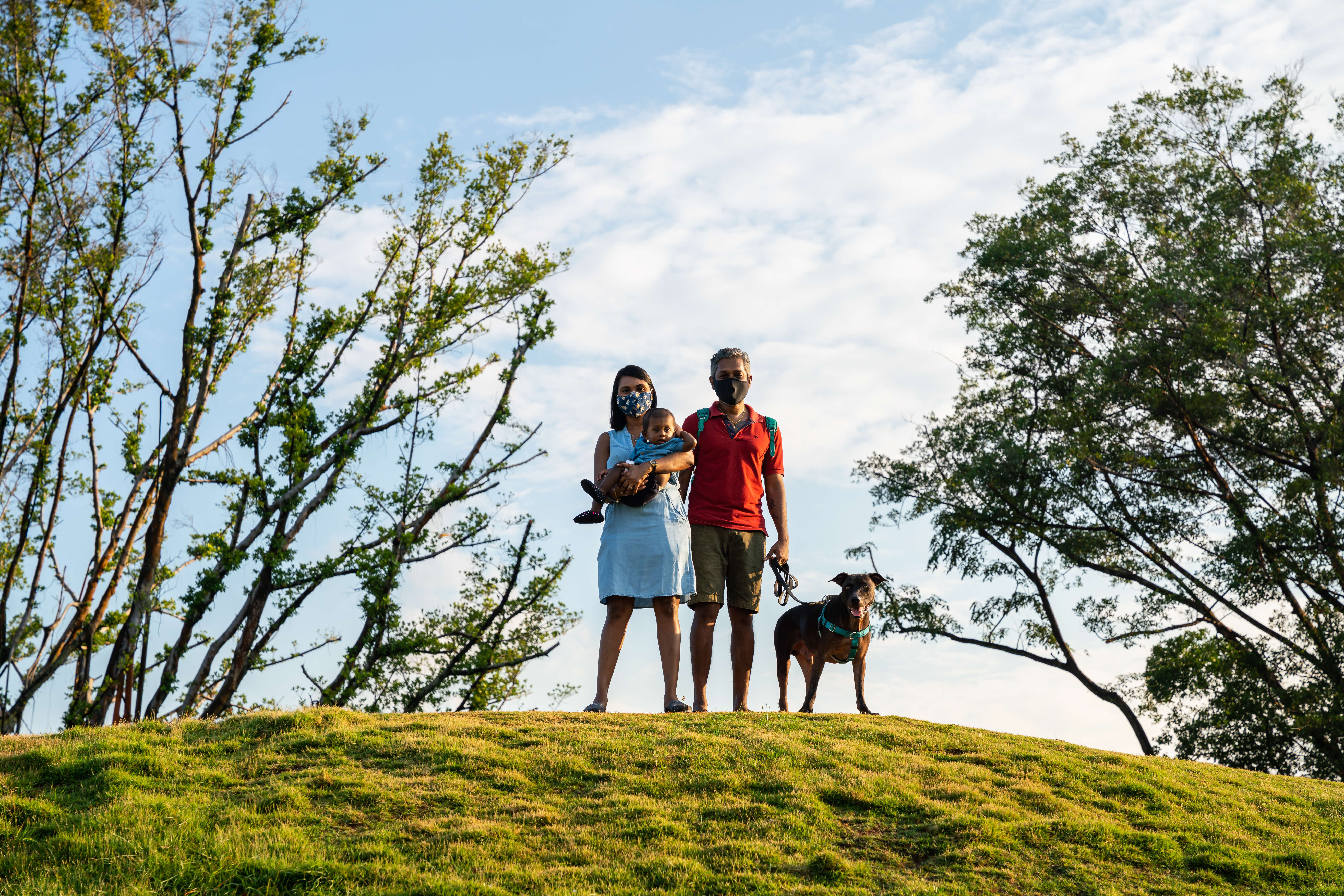 A photograph of a family with their dog