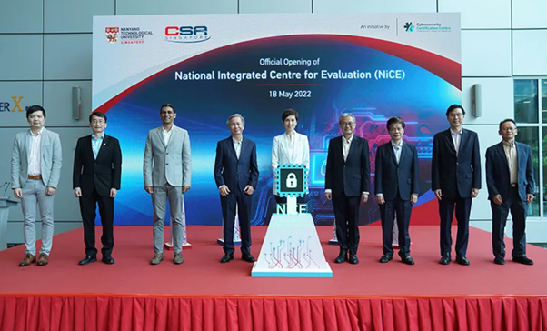 Nine people stand on a stage at the official opening of National Integrated Centre for Evaluation on 18 May 2022.