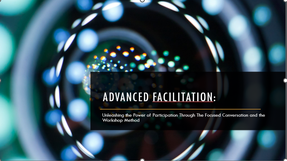 A professional title slide with the text 'ADVANCED FACILITATION: Unleashing the Power of Participation Through The Focused Conversation and the Workshop Method'. The background is a dark, abstract image of glowing blue and green bokeh light circles.