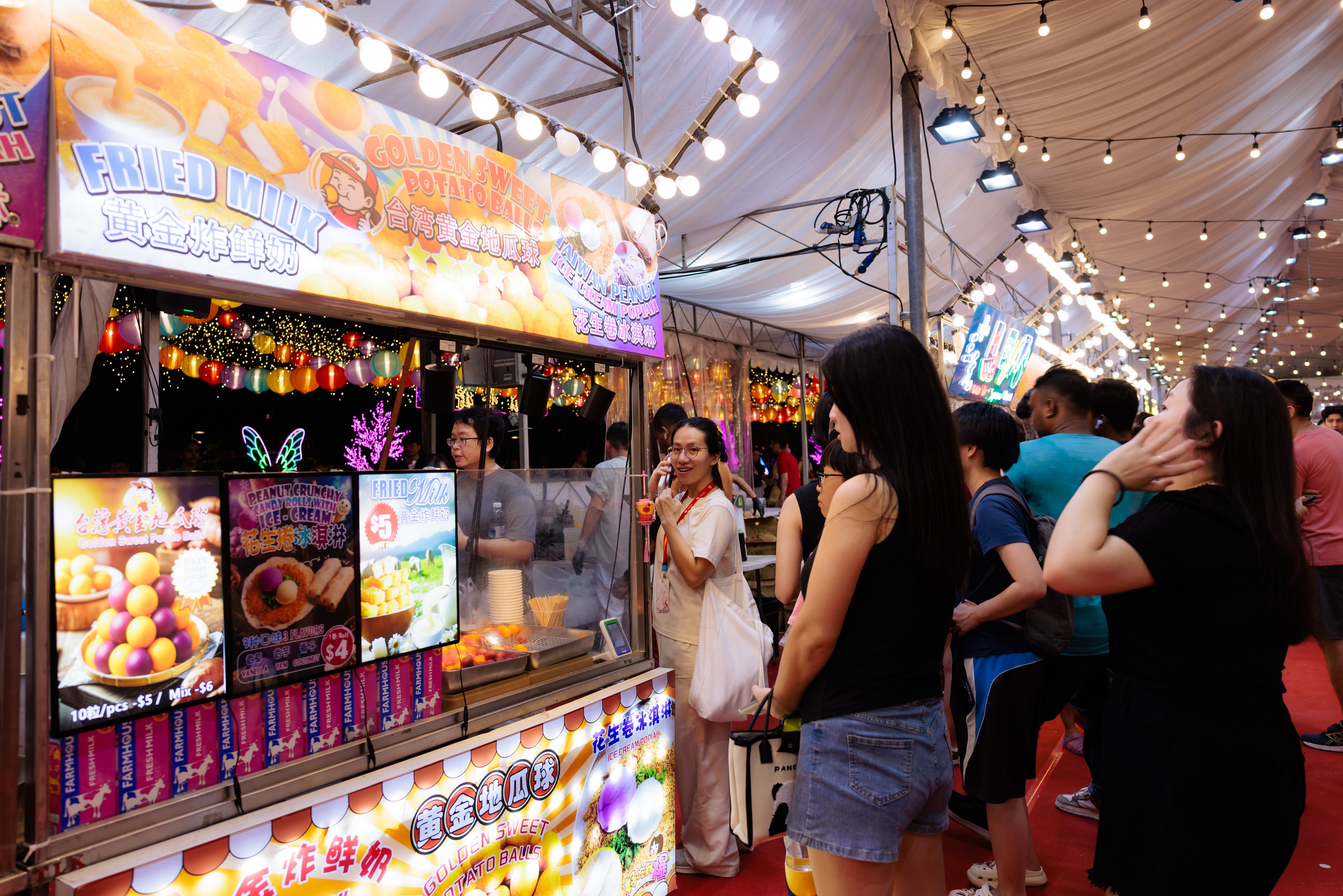 crowds queueing at food stalls at the Food Market during the lights by the lake event