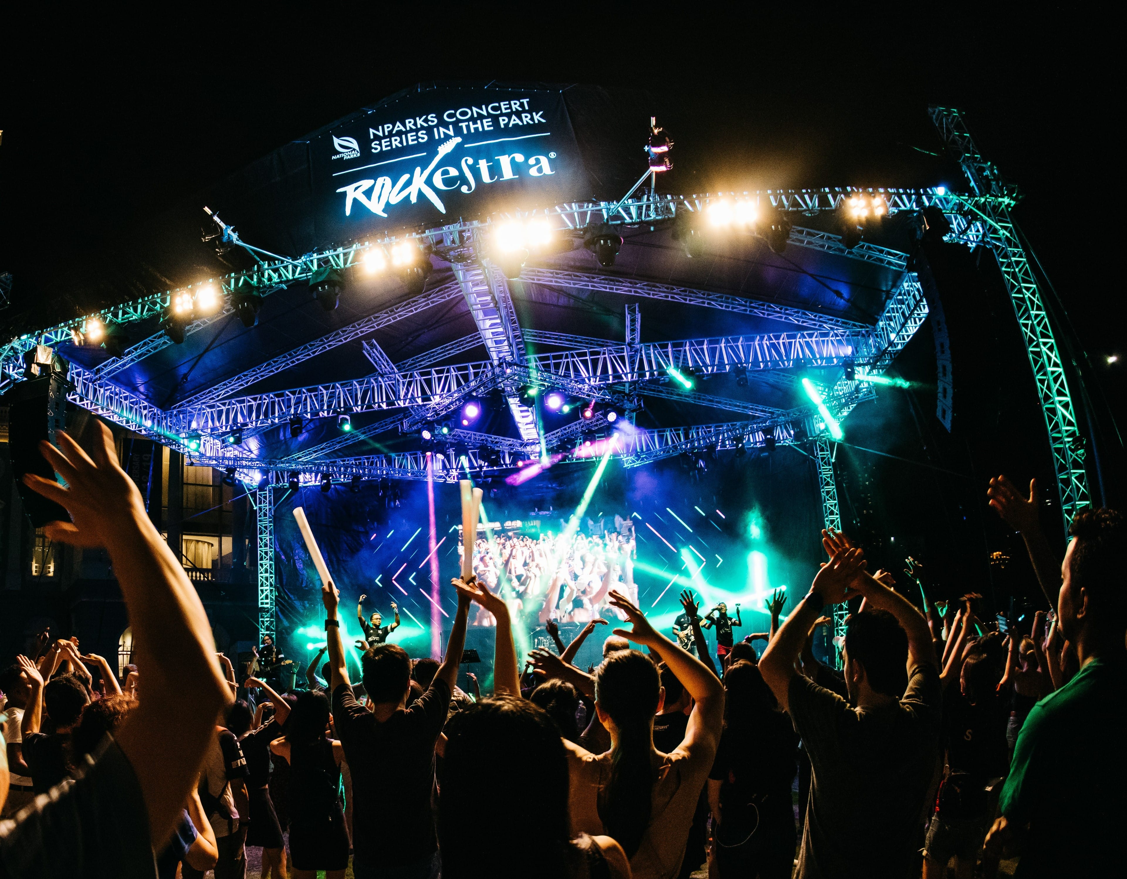 excited concertgoers at a rockestra concert