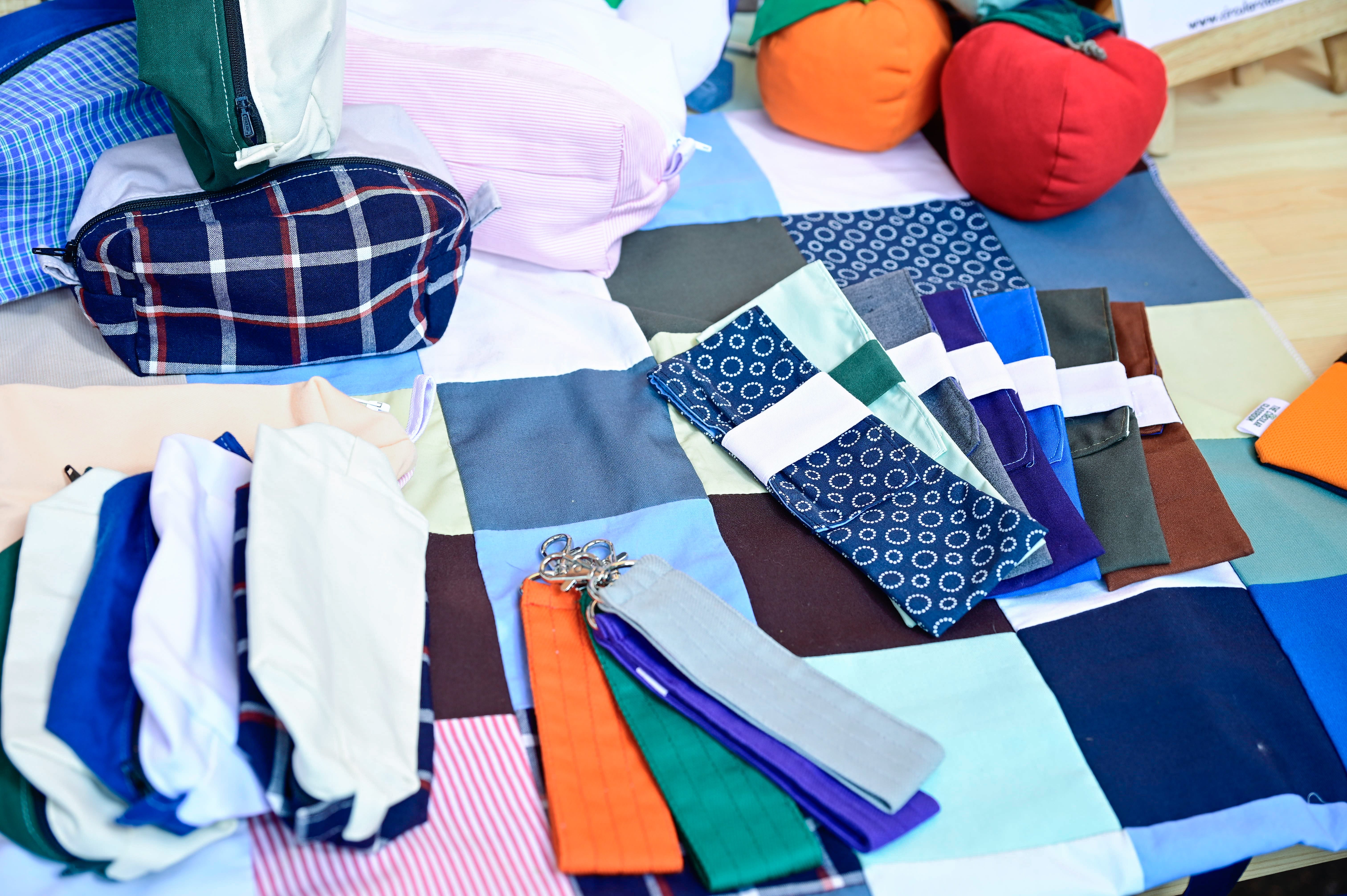The photo shows pieces of fabric that has been reused and repurposed into products.