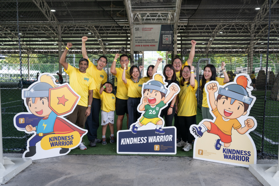 Partners and volunteers smiling at camera
