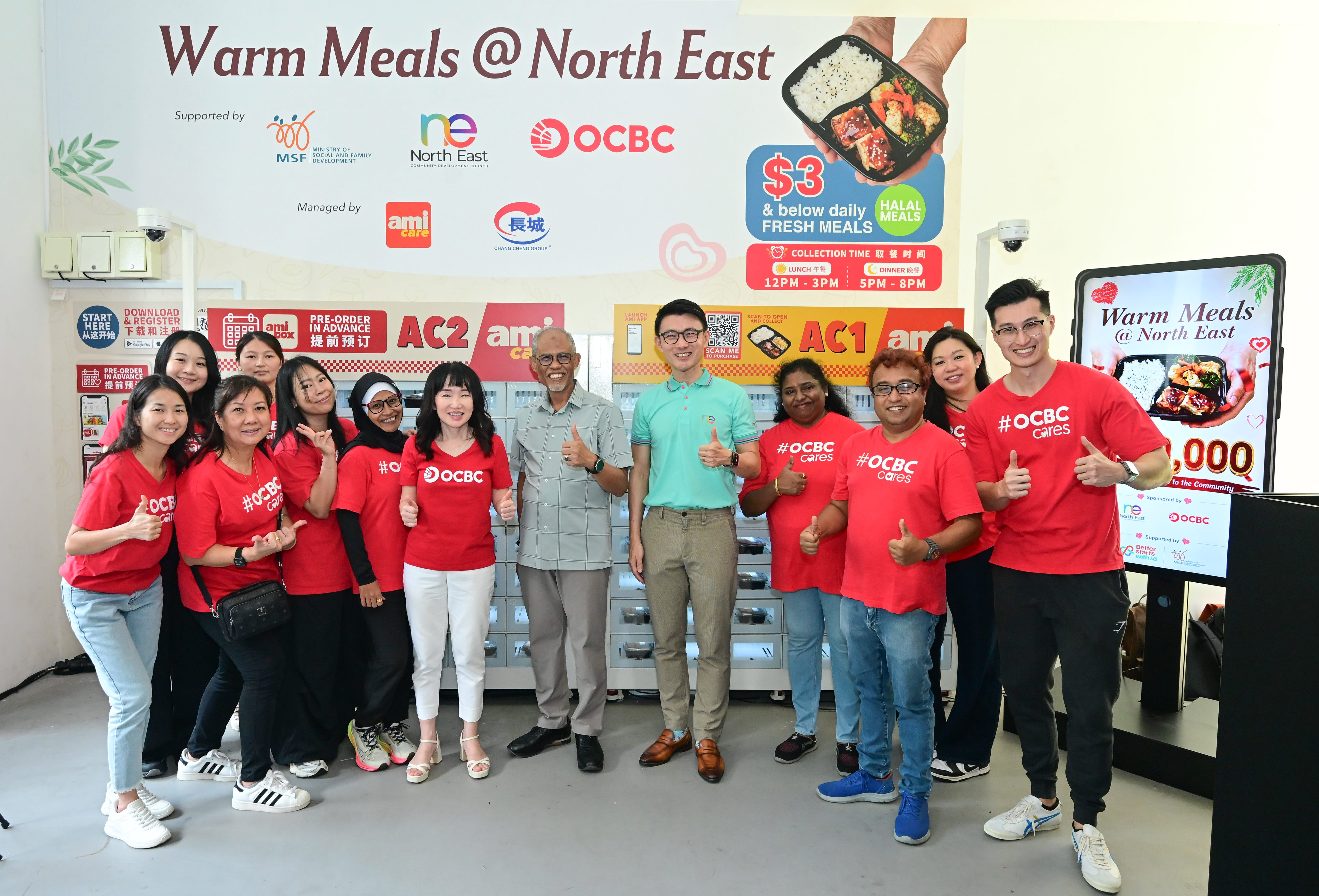 Group shot of Mr Masagos, Mr Baey Yam Keng and OCBC volunteers
