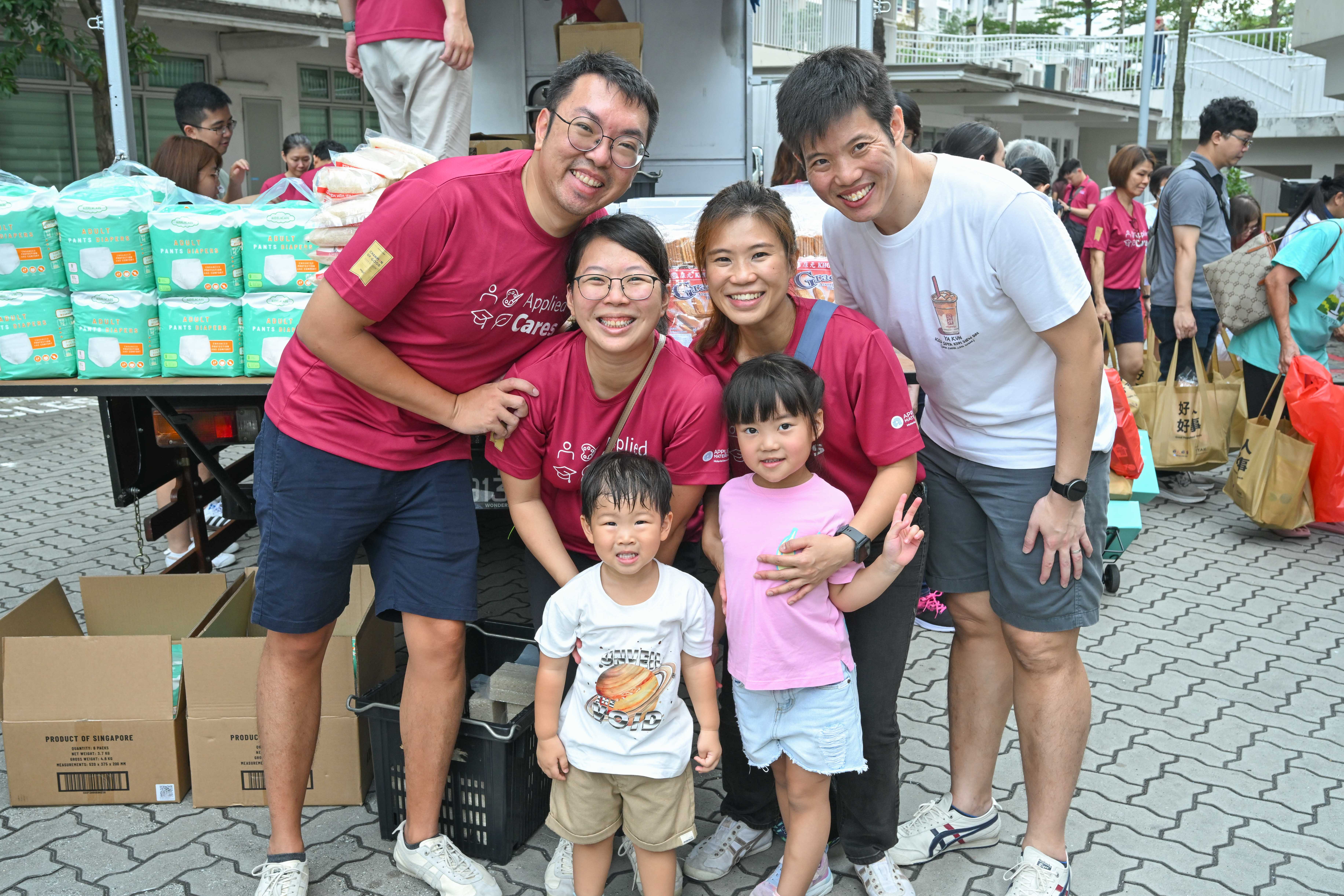 Volunteers pose with children
