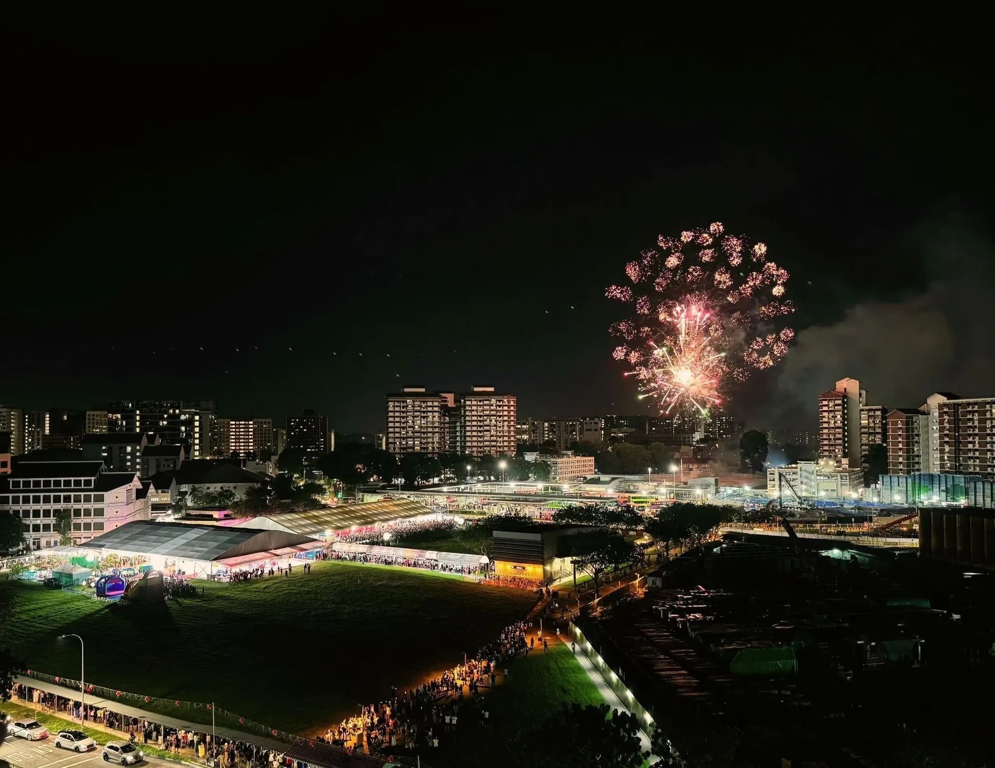 Wide view of the North East Countdown event with firworks going off against the night sky.