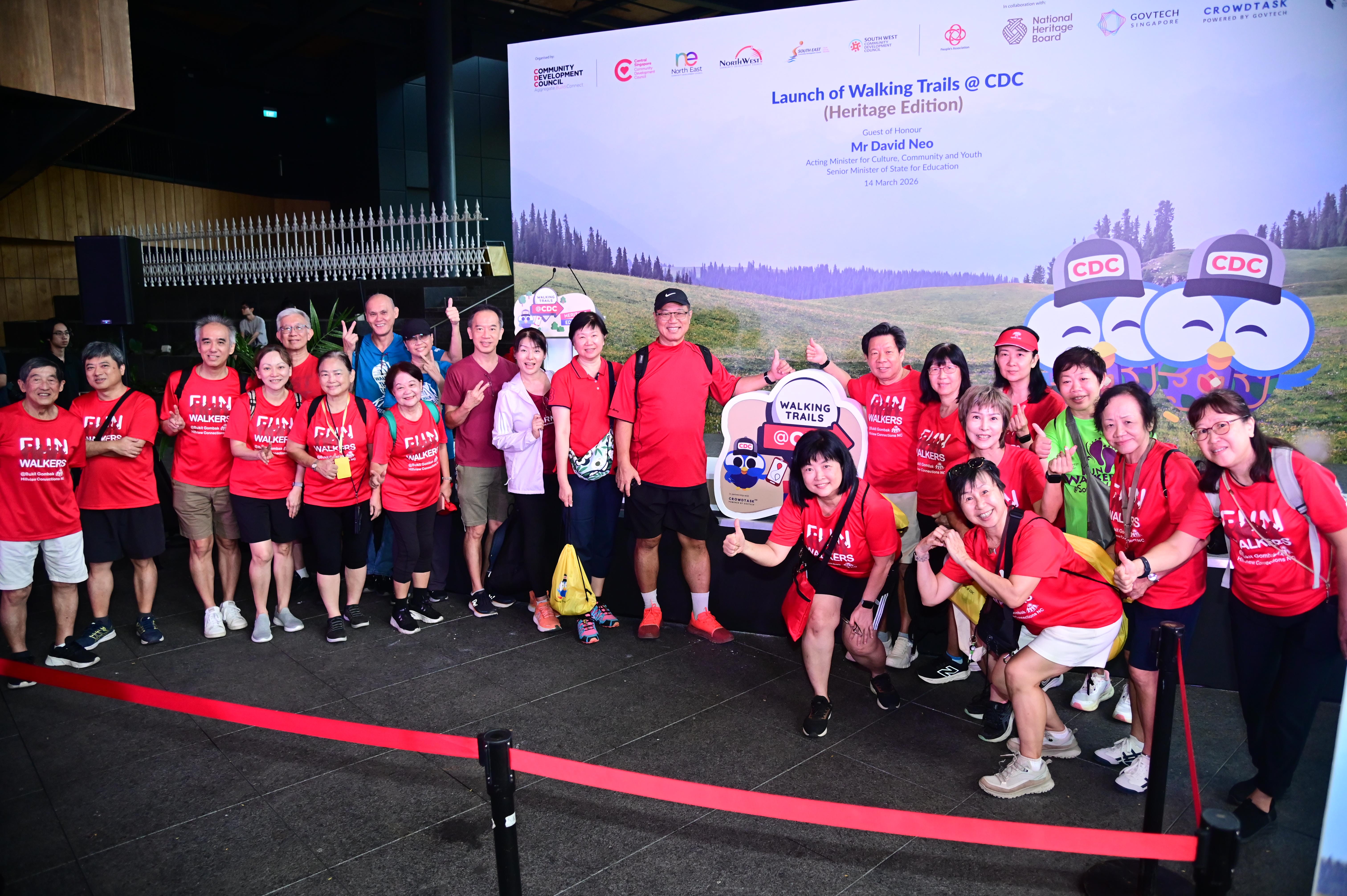 Group of participants posing at the launch of the community walking trails event, celebrating active and healthy living.
