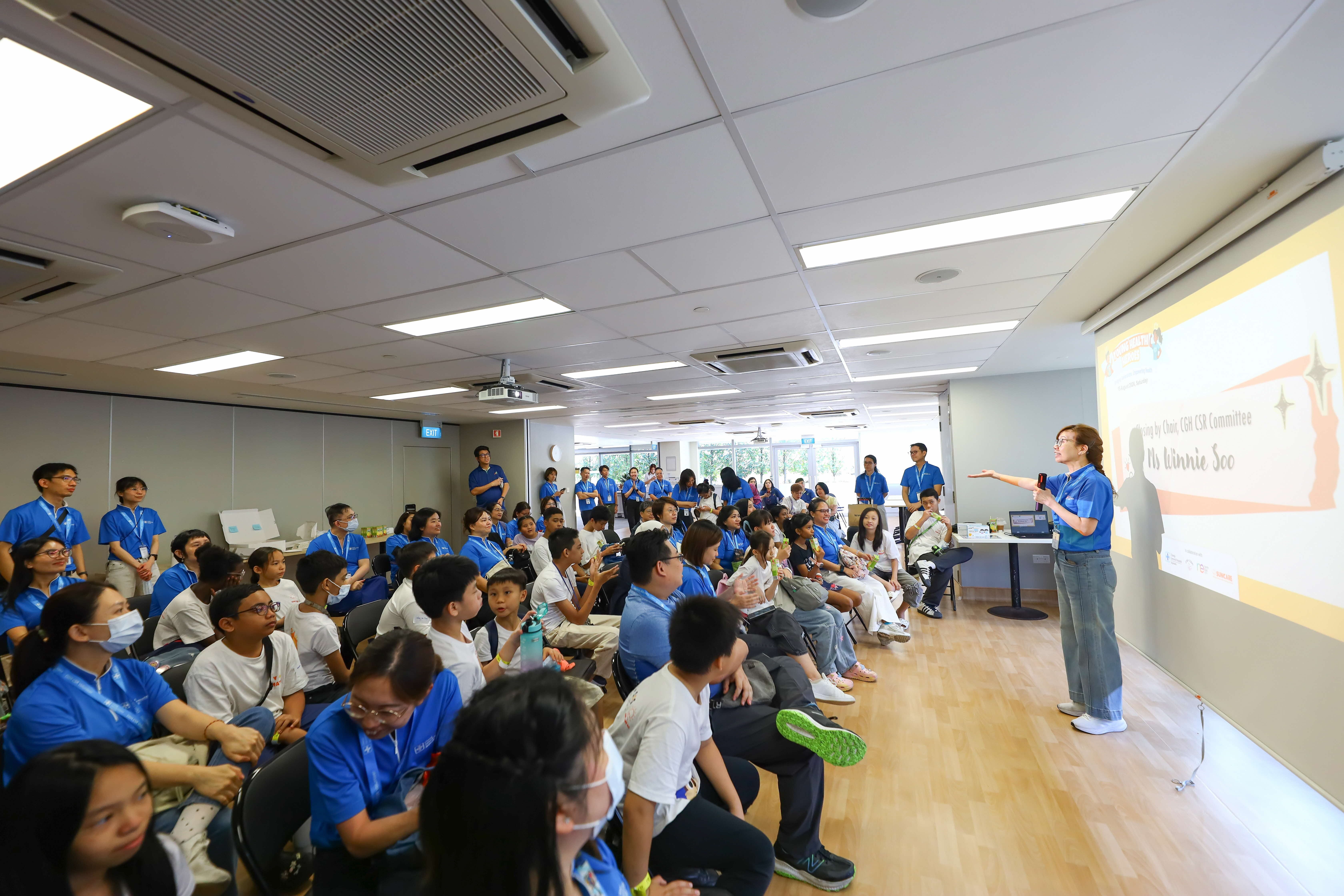 Young Health Heroes participants gathered for a sharing session with CGH volunteers at Changi General Hospital.