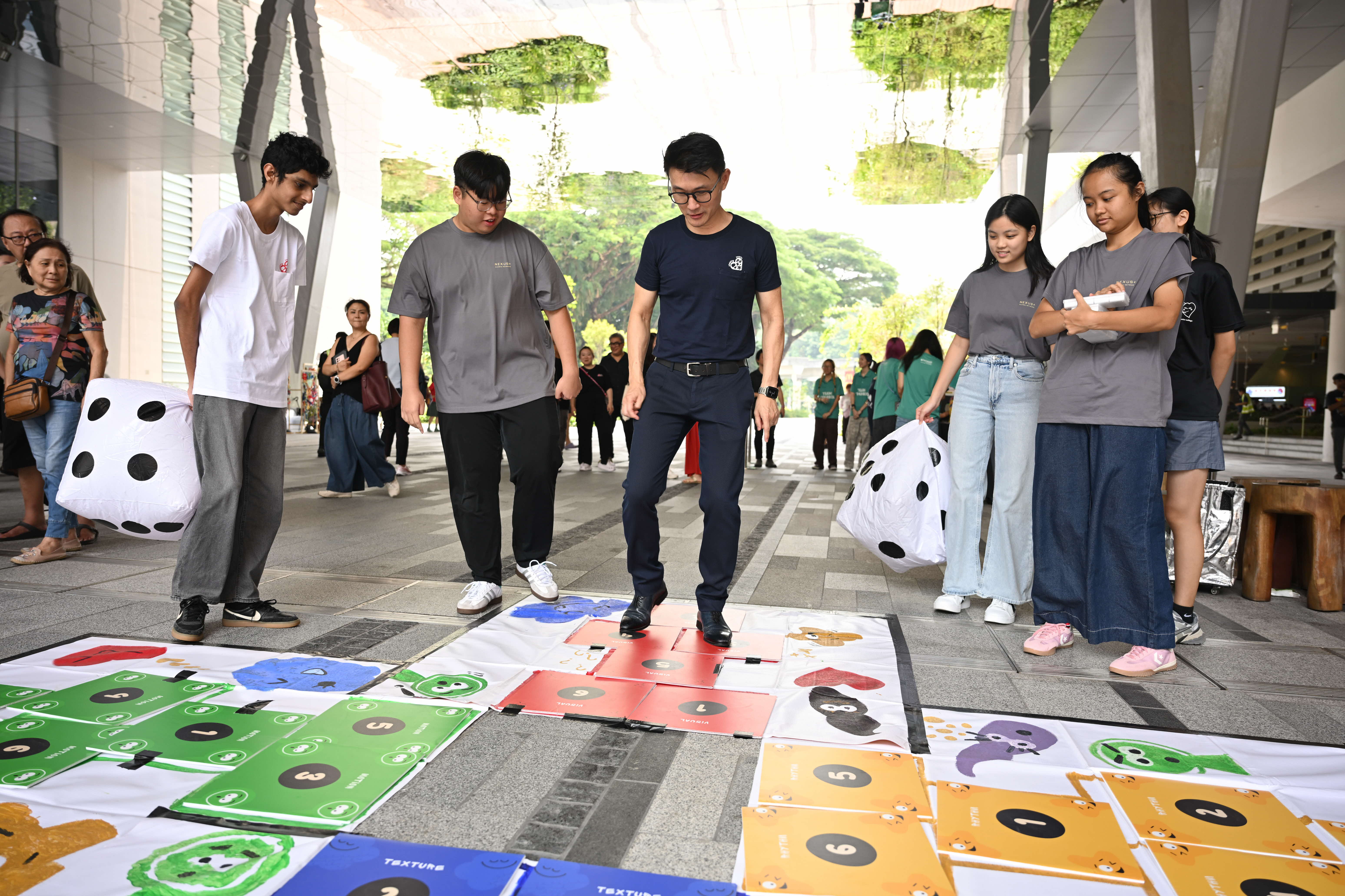 Mayor Baey Yam Keng participating in our hopscotch activities led by student volunteers!