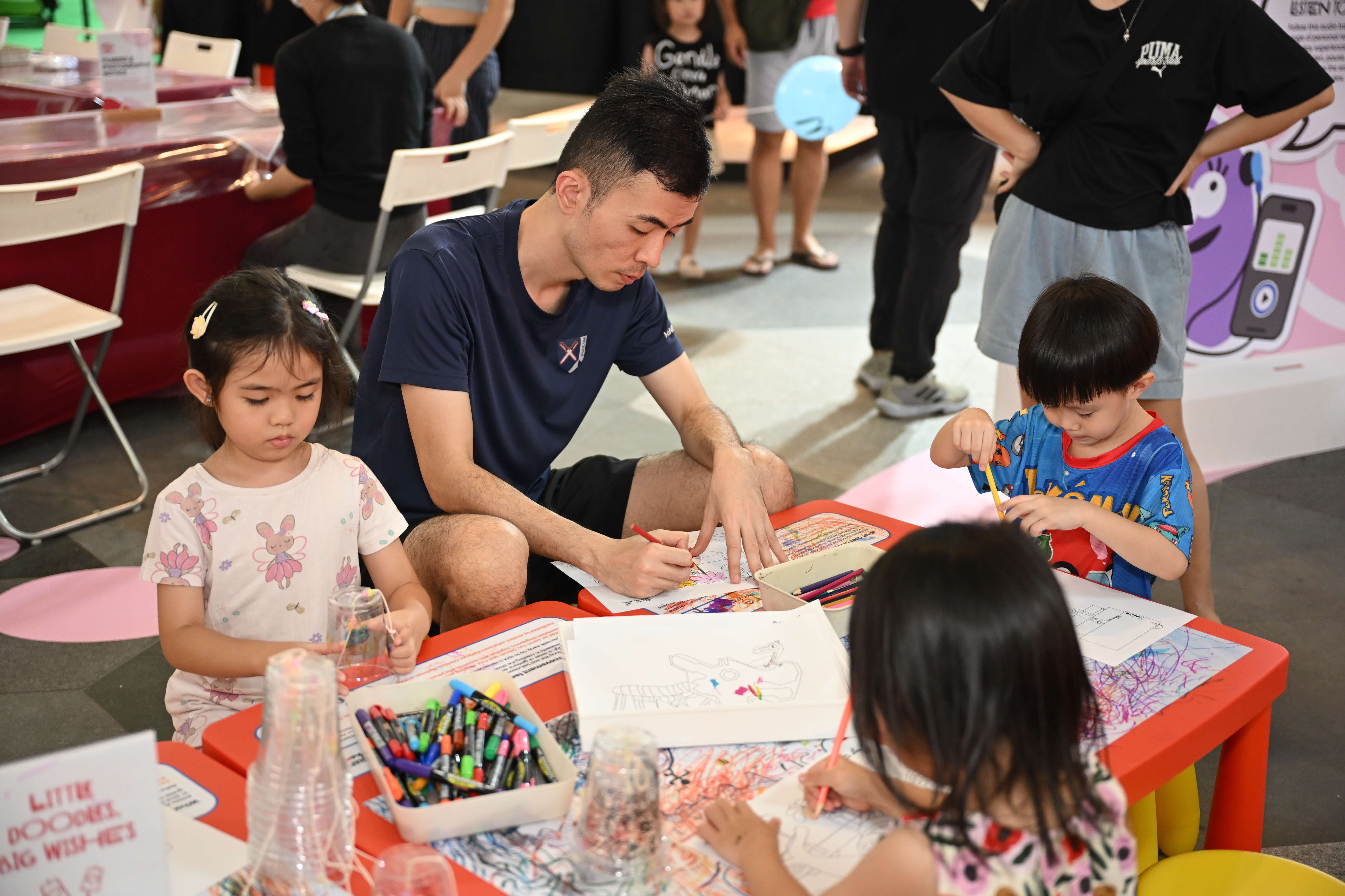 Participants colouring iconic places and landmarks of Singapore!