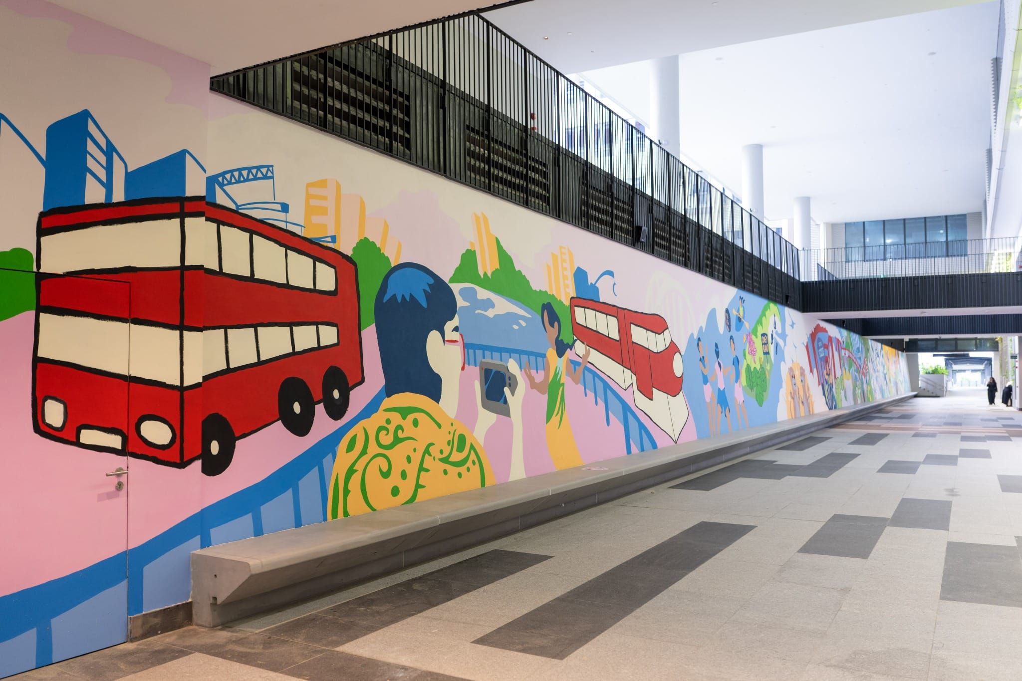 Angled view of the completed mural with buses, bridges, people and Punggol landmarks.