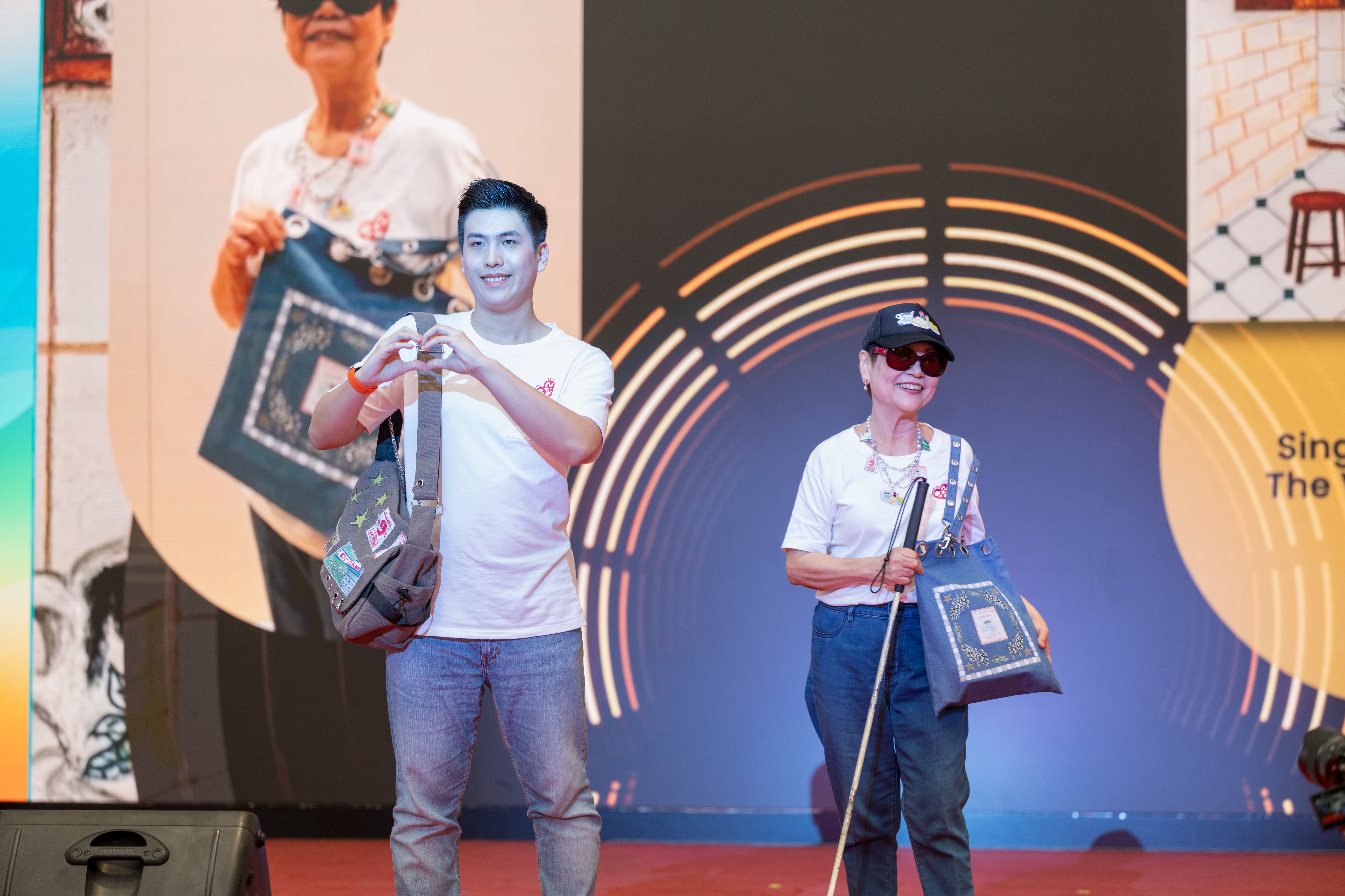 Close up shot of two persons with disabilities walking on the fashion runway.
