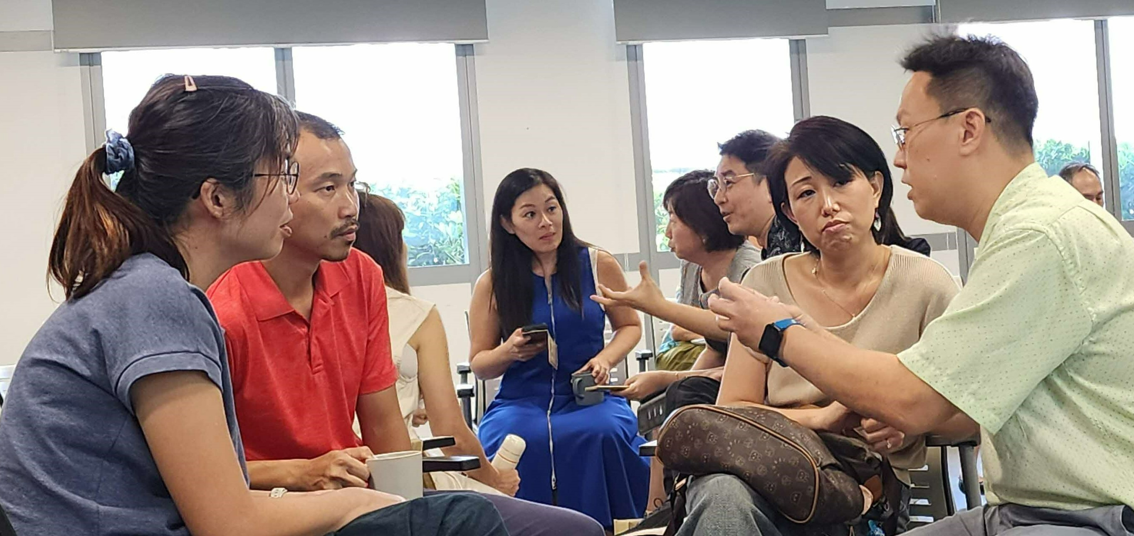 group of educators discussing