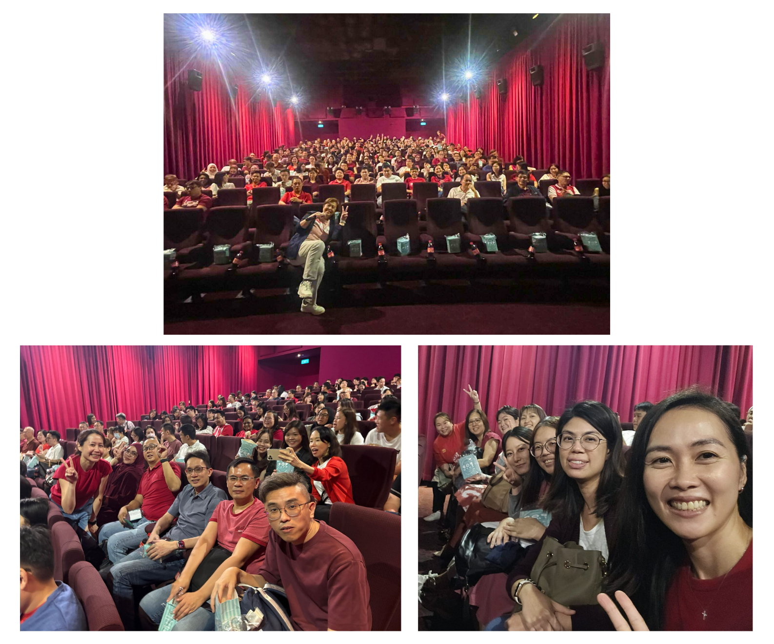 A crowded theater with people seated in red chairs and some posing for photos in front of red curtains.