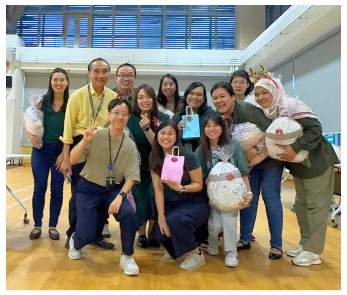 Members of the 2025 SEABlings’ Committee which organised the "It's (Finally) Friday Season's Greetings" event with SEAB's Chief Executive, Mr Yue Lip Sin.