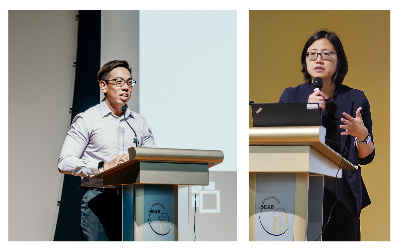 Two individuals are standing at podiums, giving presentations with microphones and laptops.
