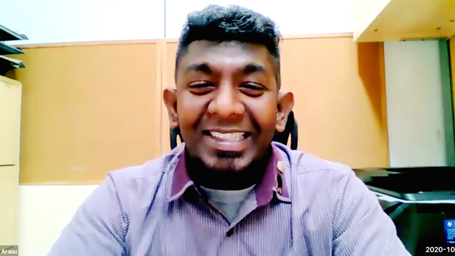 Portrait of Arasu smiling