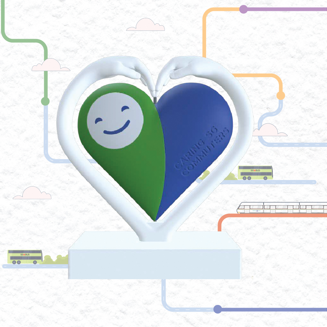 A heart-shaped trophy with the Caring SG Commuters logo at the centre, set against a backdrop of illustrated transport lines.