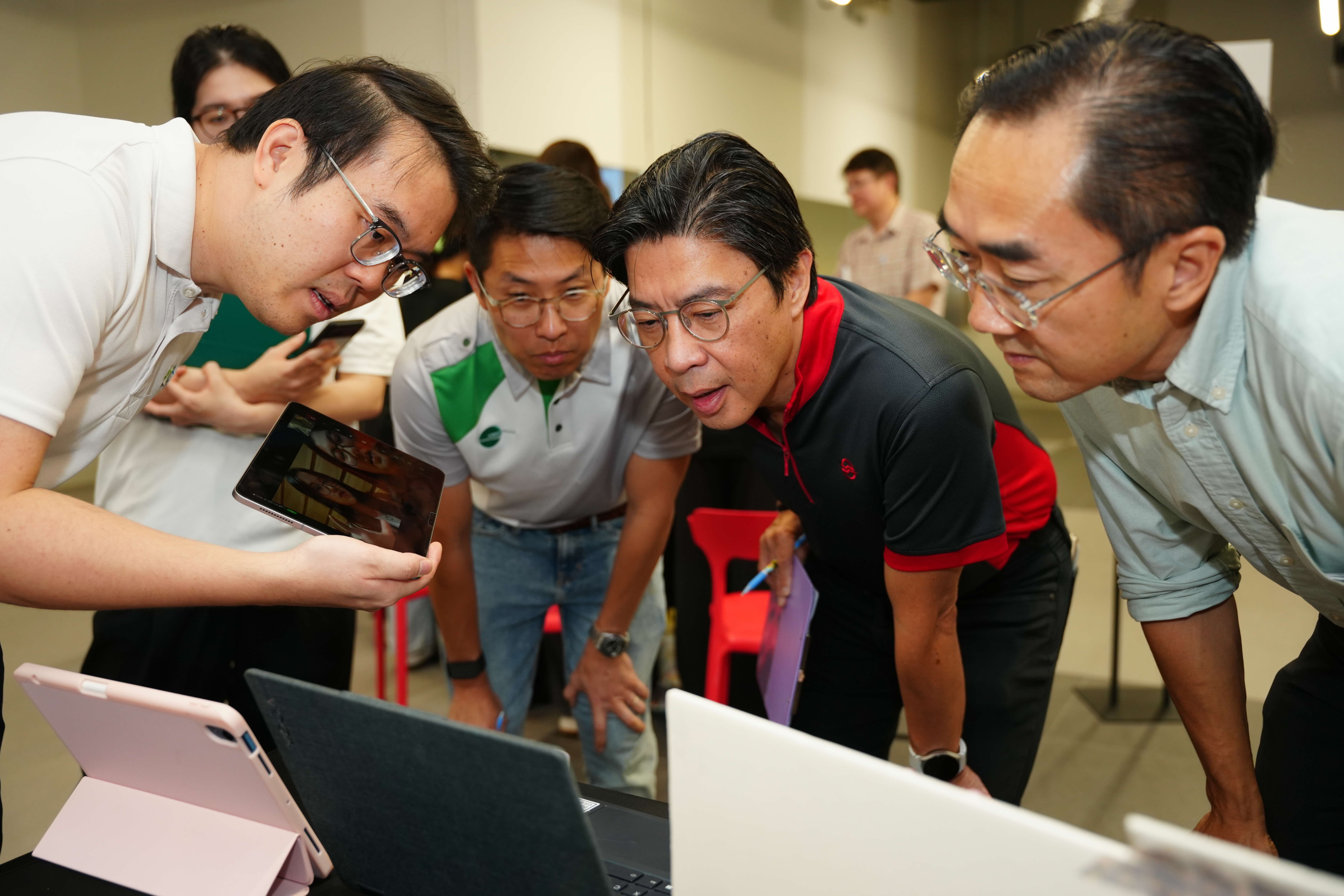 Add your alt text herePhoto of Mr Glenn Lim, Mr Alvin Kek and Mr Goh Pin Kai listening to the student’s pitch during the judging session 