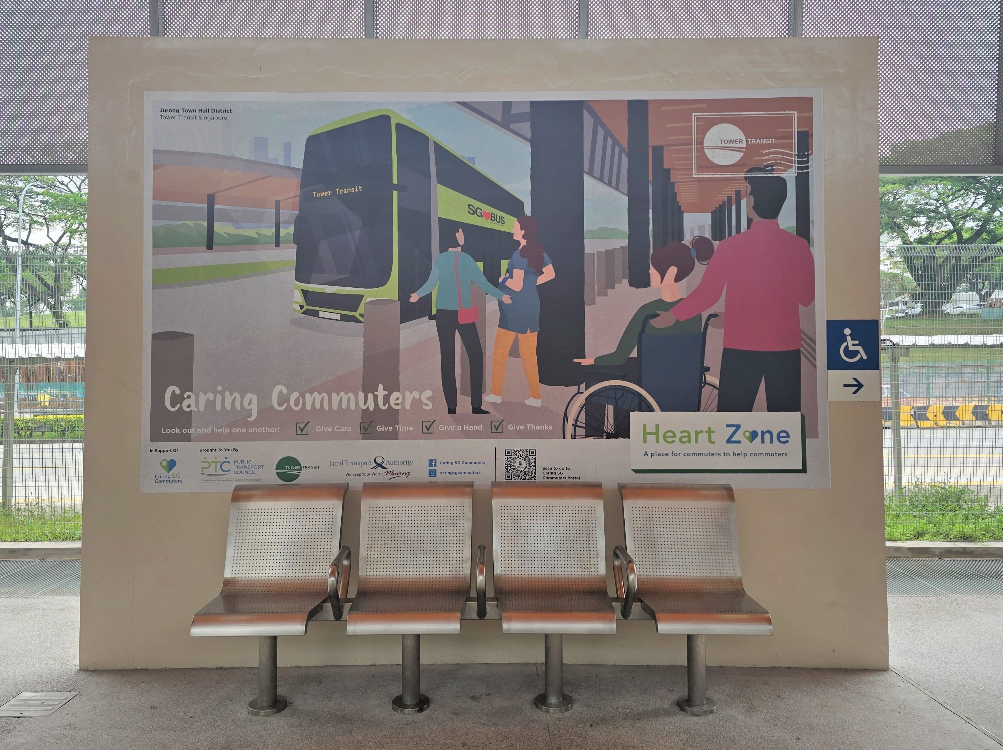 Heart Zone display at Jurong Town Hall Bus Interchange showing commuters assisting one another with “Caring Commuters” message.