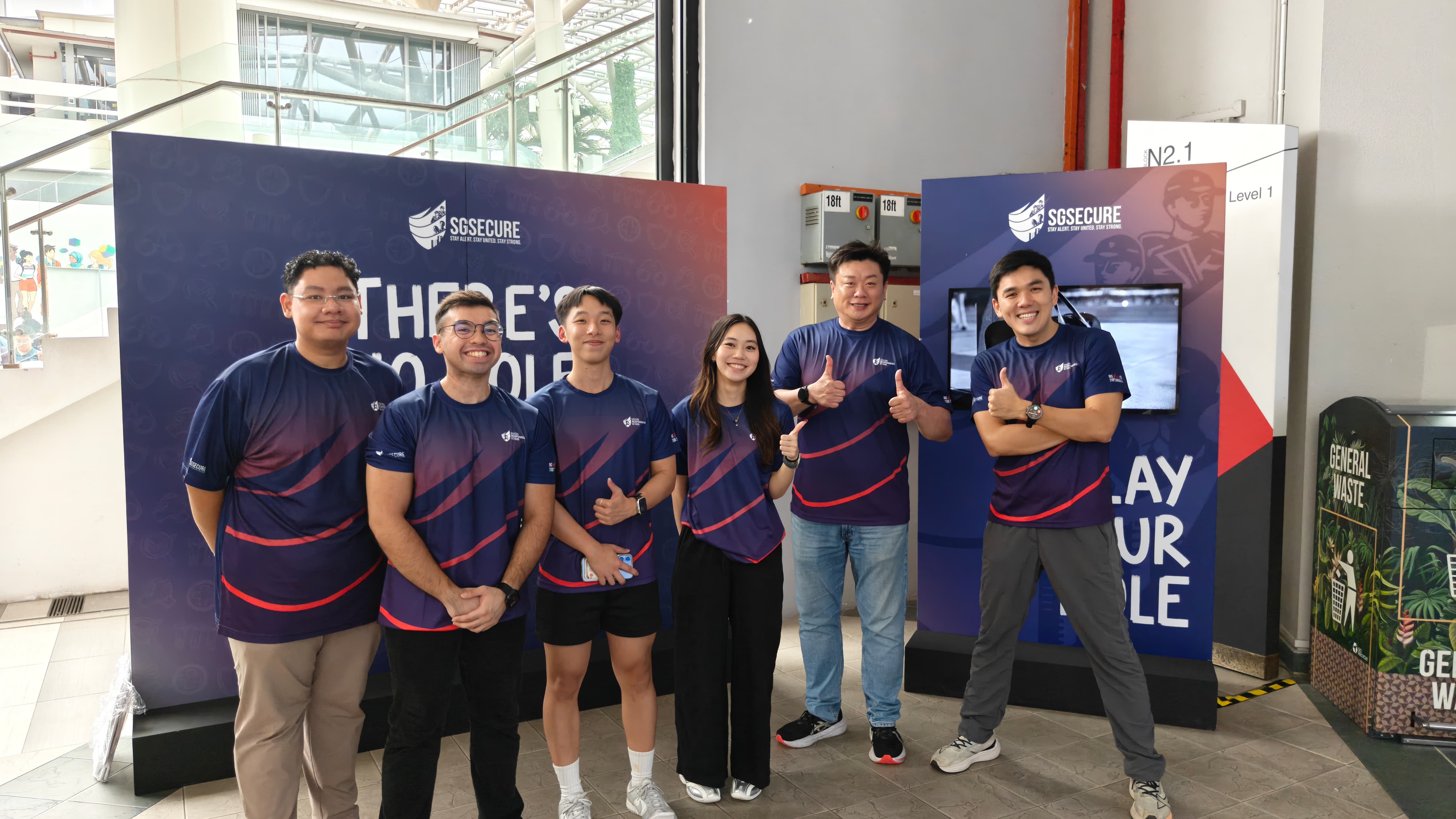 SGSecure officers taking photos with students