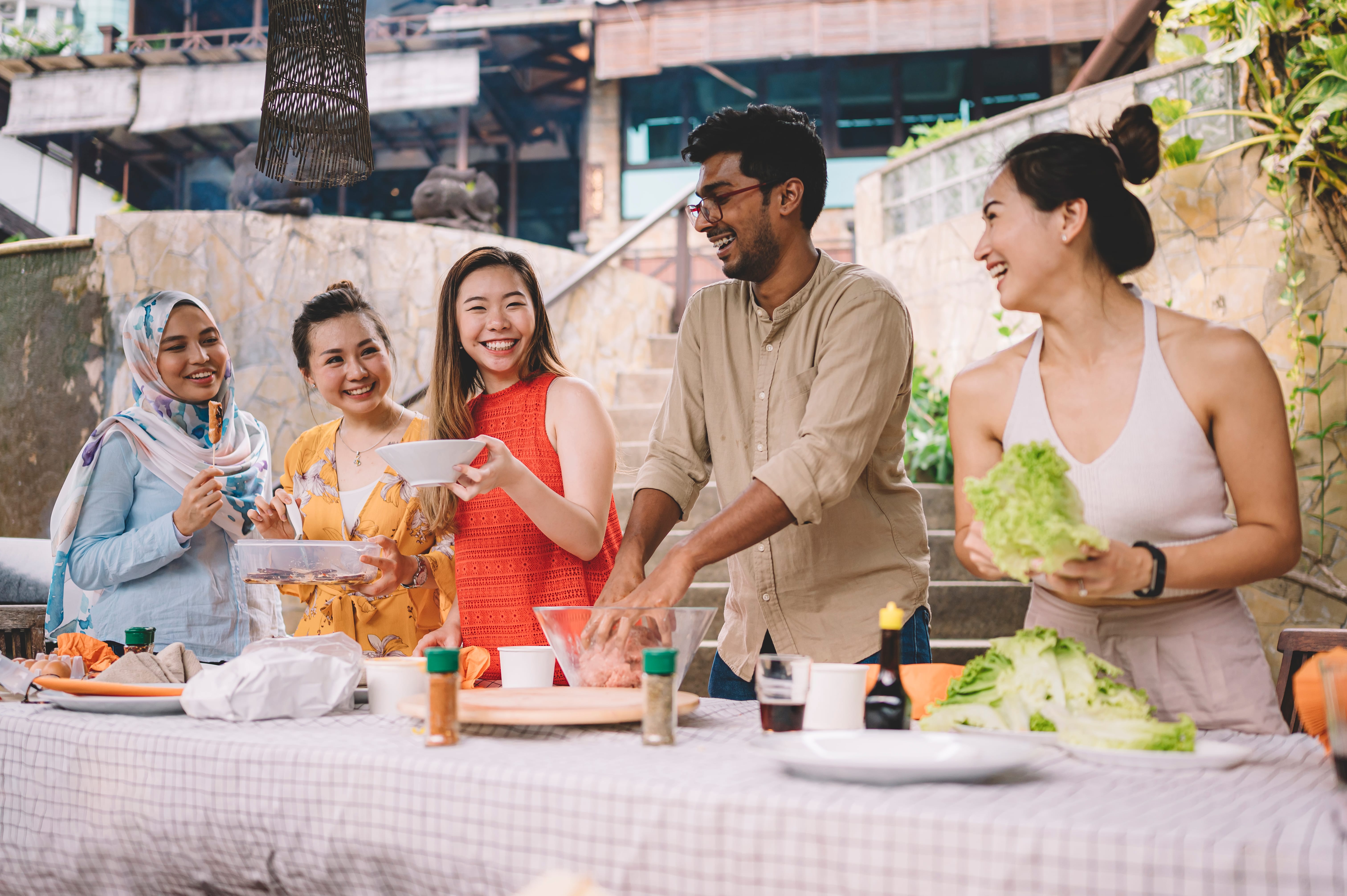 People of different races having a potluck