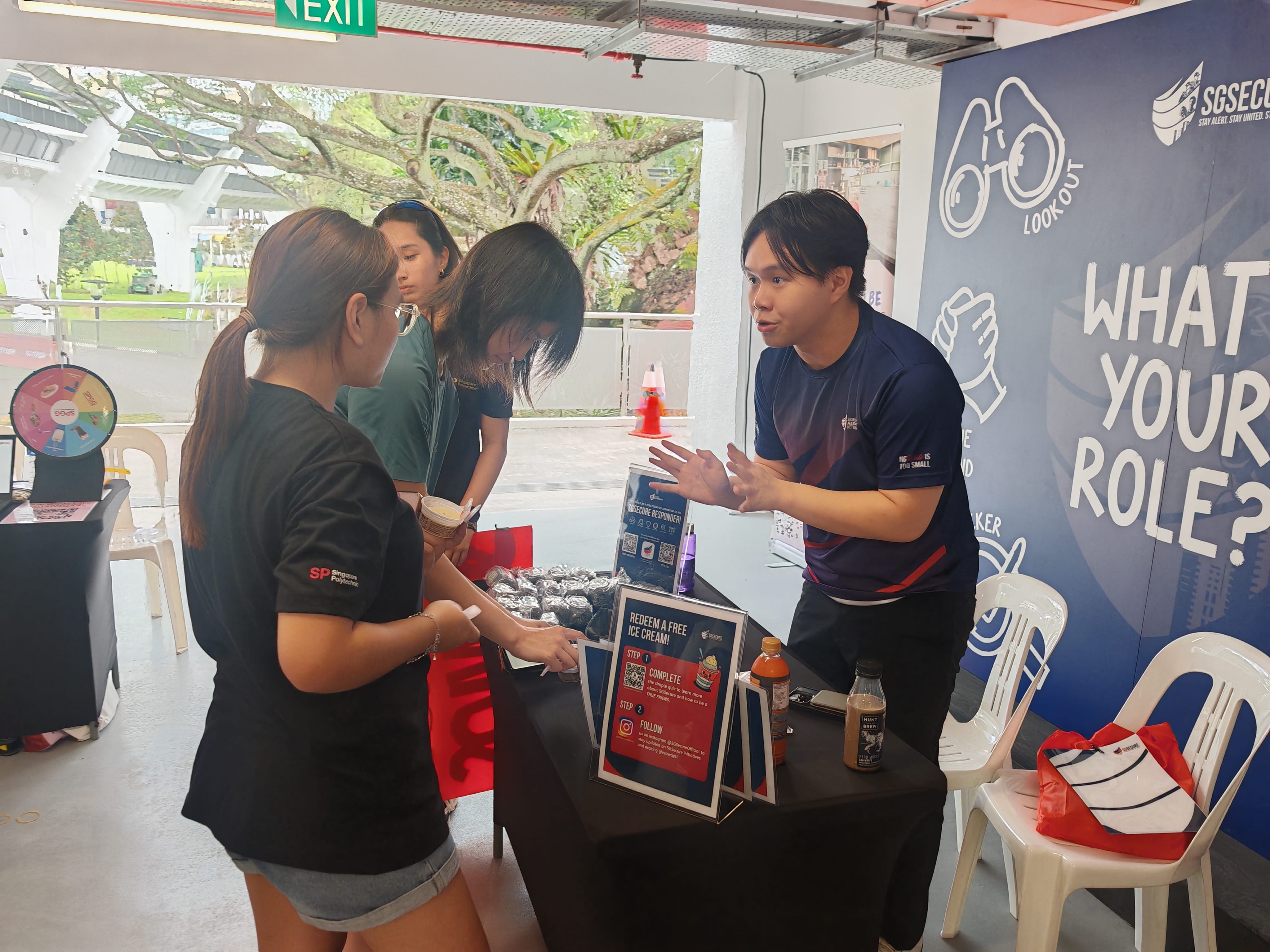 Advocates engaging their peers at the SGSecure outreach booth