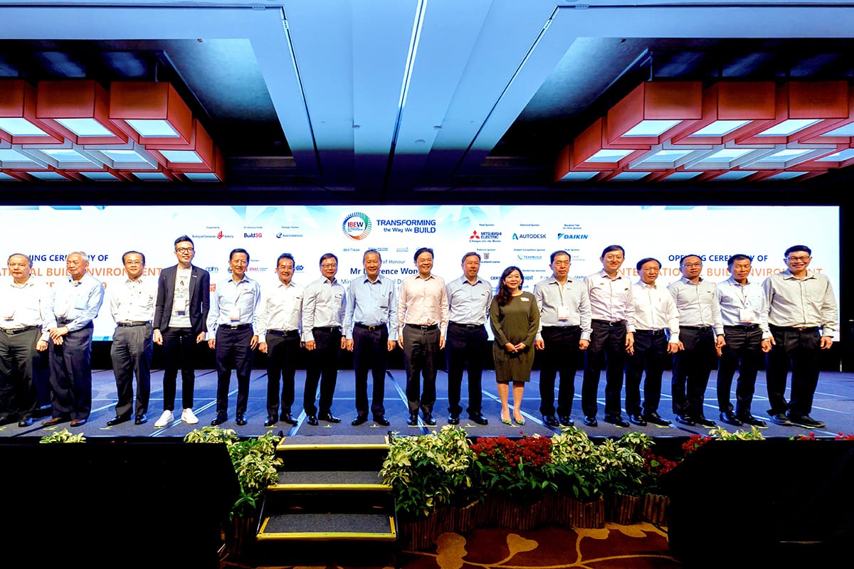 Group of people on stage in front of screen with logos: Autodesk, Daikin.