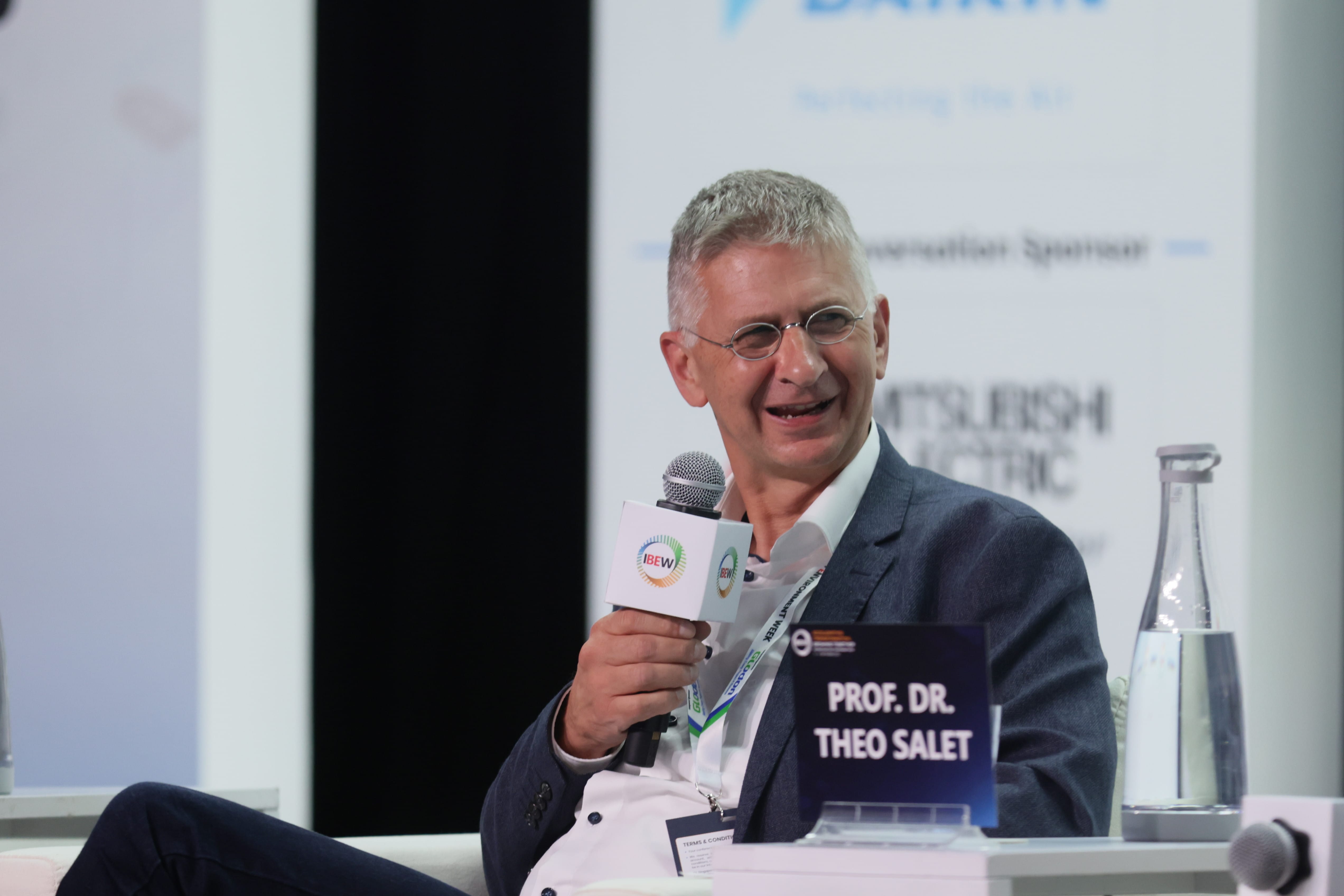 Prof. Dr. Theo Salet speaks into an IBEW microphone during Environment Week.